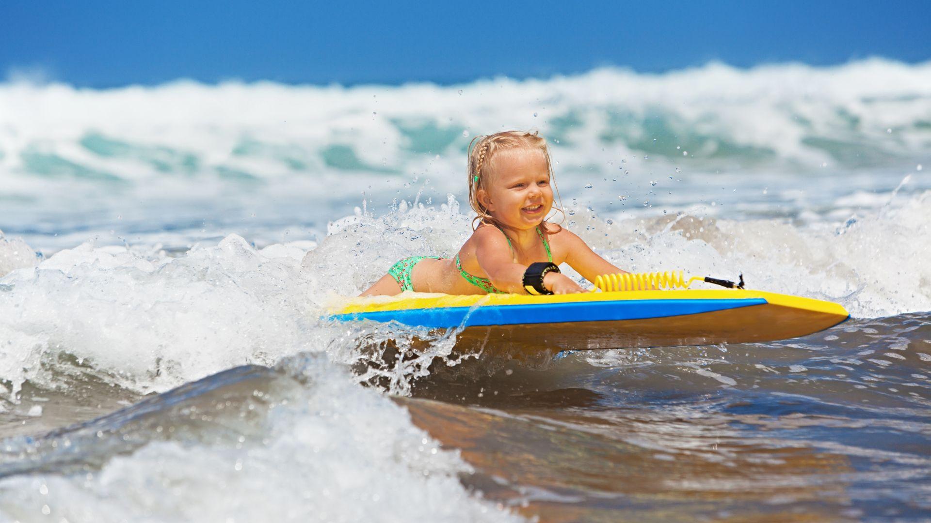 1920x1080 Little girl in the sea on a surfboard Desktop wallpaper 1920x1080