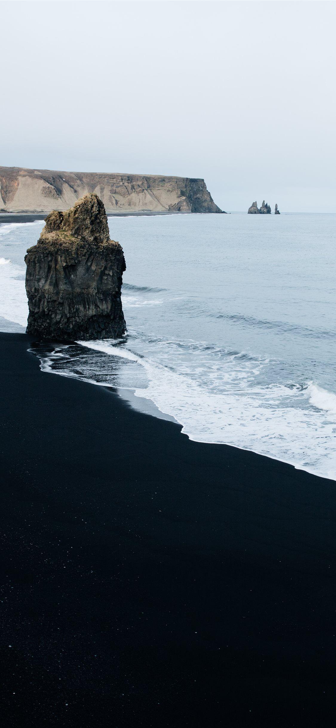 1125x2436 brown monolith rock on seashore #ocean #water #nature #beach #landscape #vik #Iceland. Iceland wallpaper, Iceland photography, Sky aesthetic