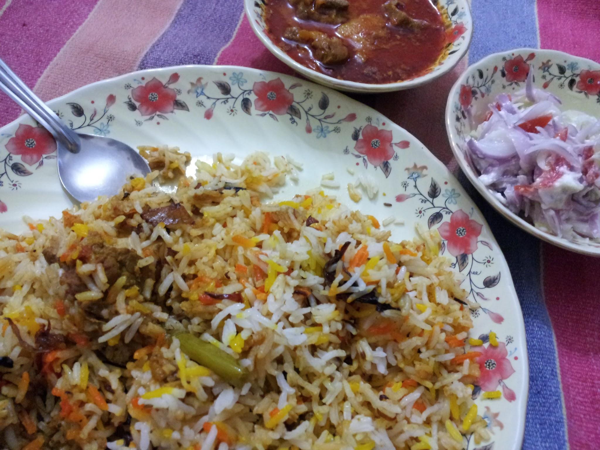 2048x1536 Homemade Chicken Biryani (Indian Chicken Spicy Rice), Chicken Curry and Raita (yogurt Salad)