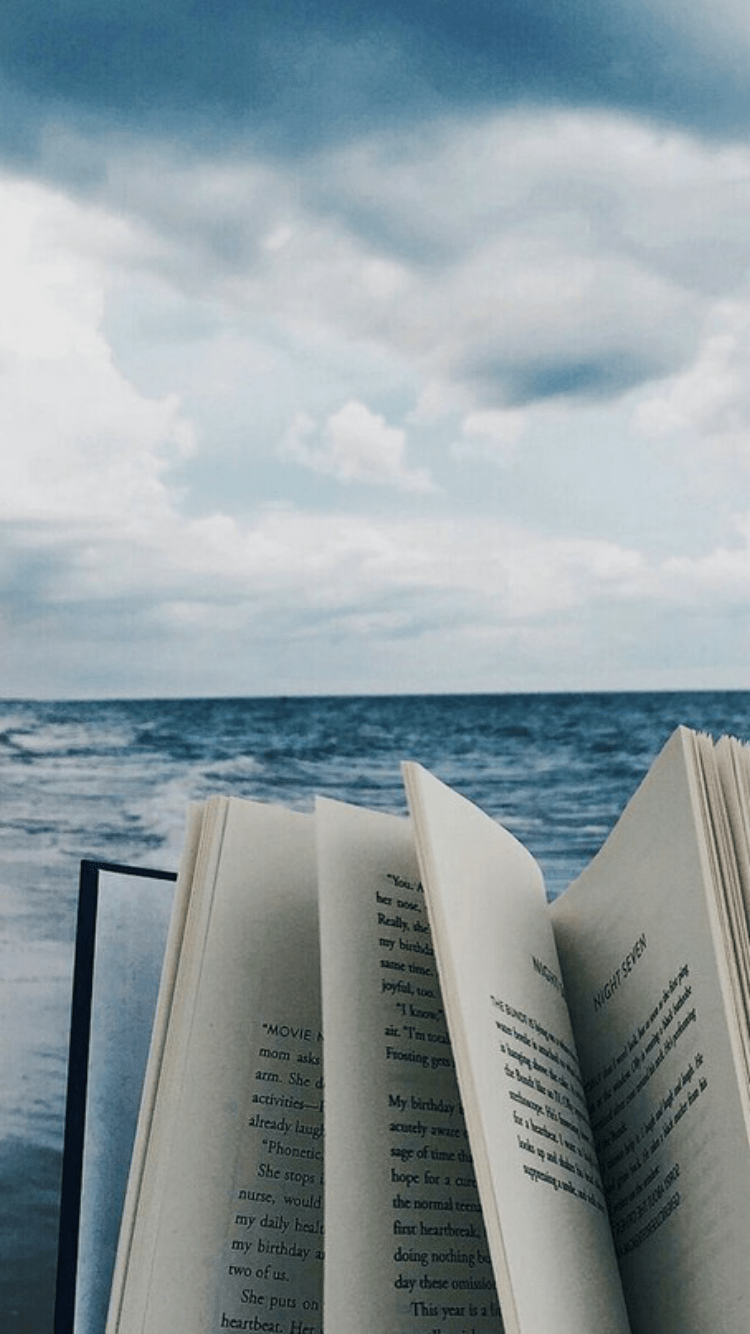 750x1334 Reading by the Seaside. A Book at the Beach. Outdoor Readers. Book wallpaper, Book photography, Book aesthetic