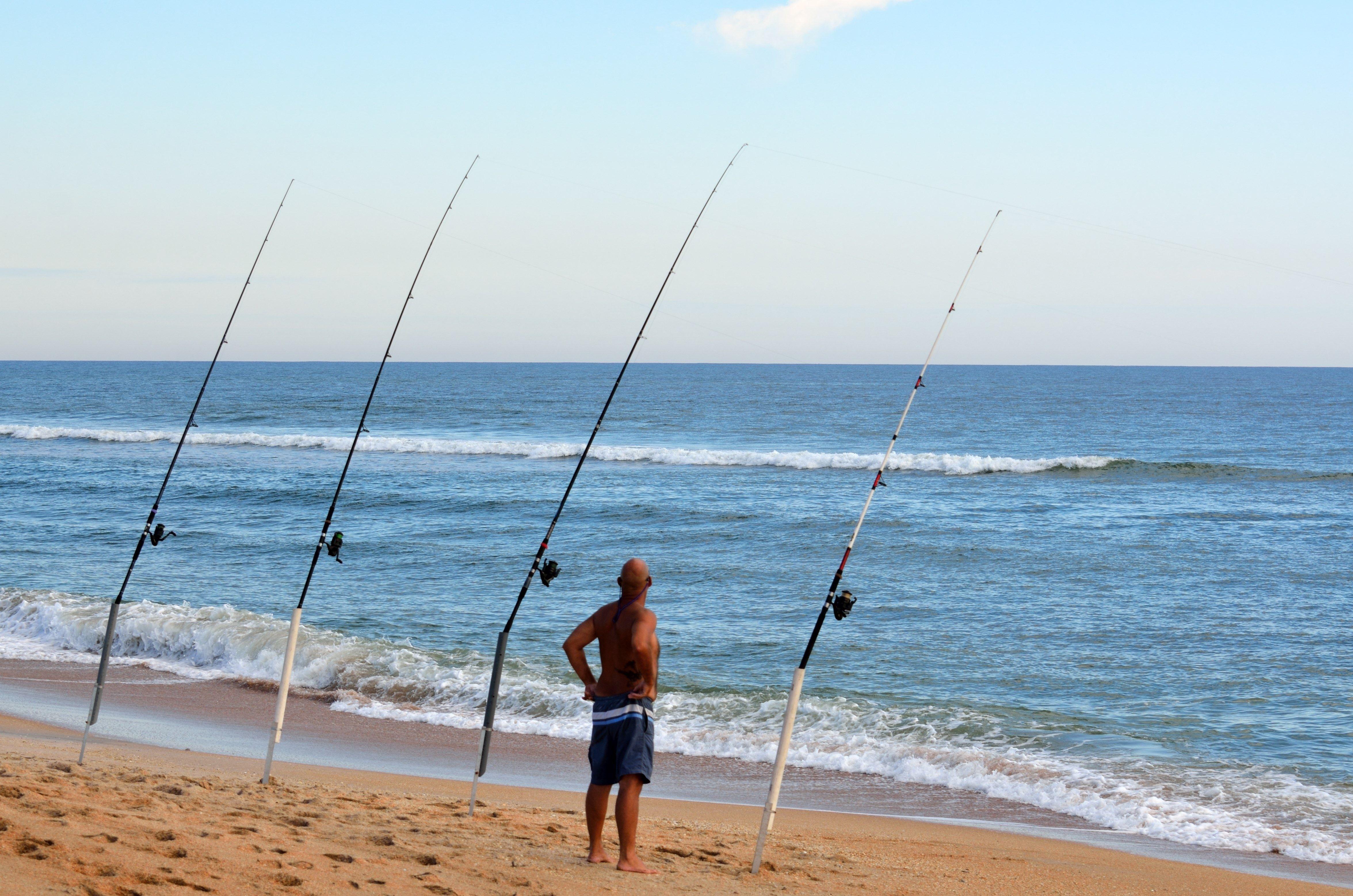 4703x3115 man fishing on a sea free image