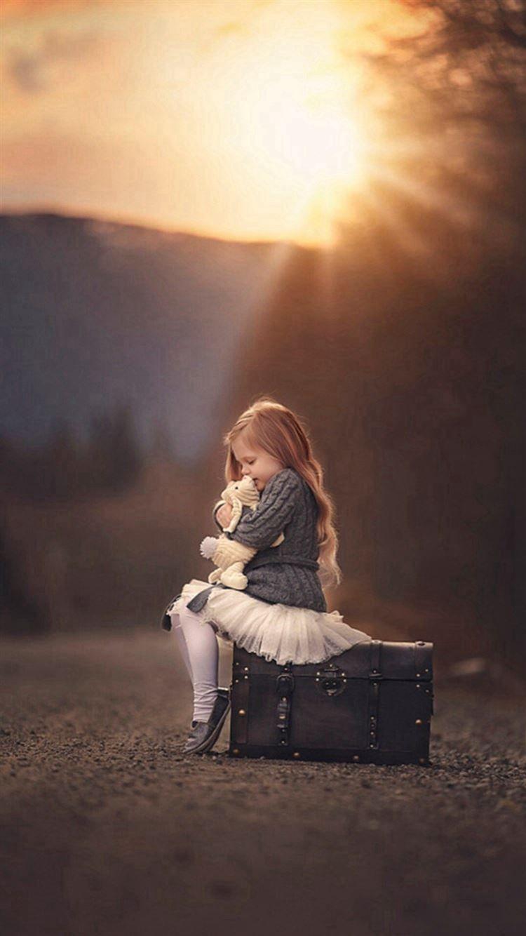 750x1334 Long Hair Cute Girl Sunshine Beside Portrait iPhone 8 Wallpaper Free Download