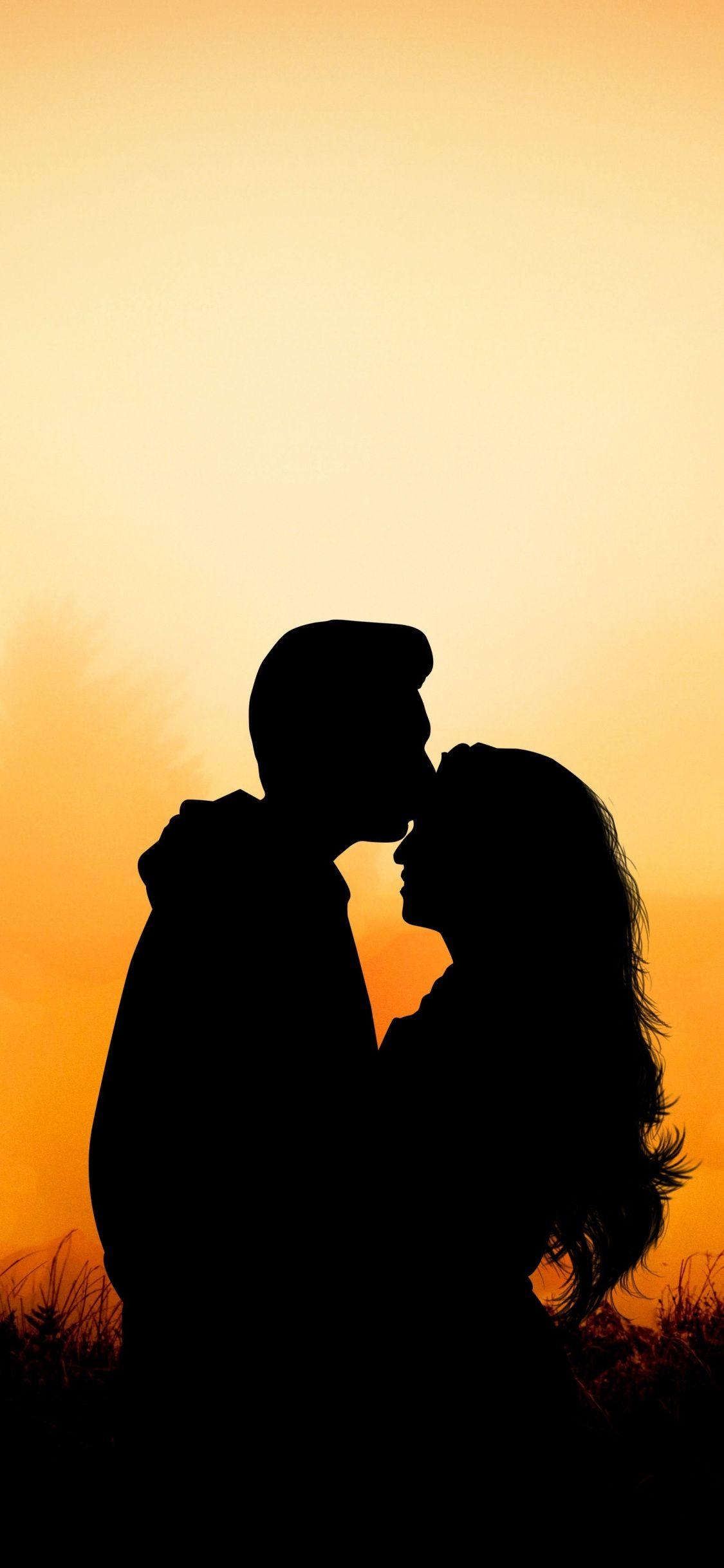 1125x2436 Couple, Hug, Kiss, Love, Outdoor, Sunset, Wallpaper Wallpaper iPhone