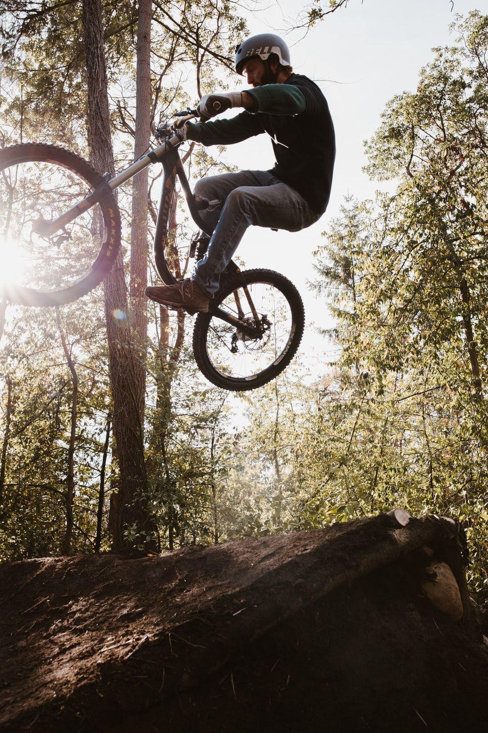 1000x1500 low angle photography of man riding BMX bike photo