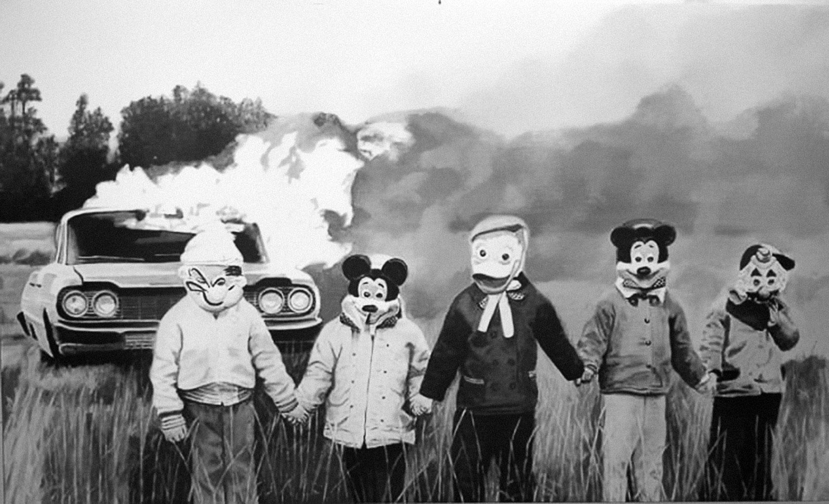 1680x1022 Creepy, vintage photo of masked figures (ie; Popeye, Mickey Mouse, etc.) holding hands in front of a burning car