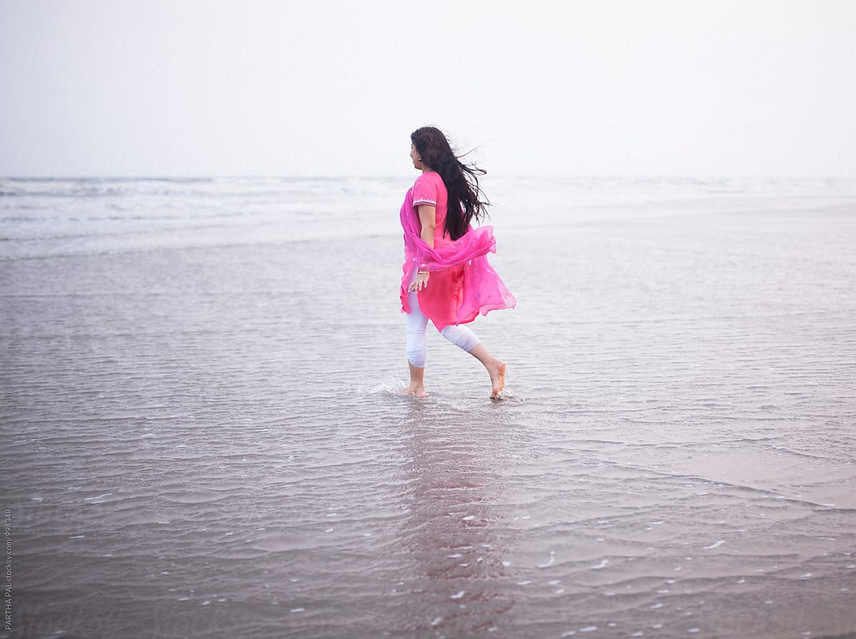 1200x896 Indian woman walking alone in sea beach by Dream Lover, Summer