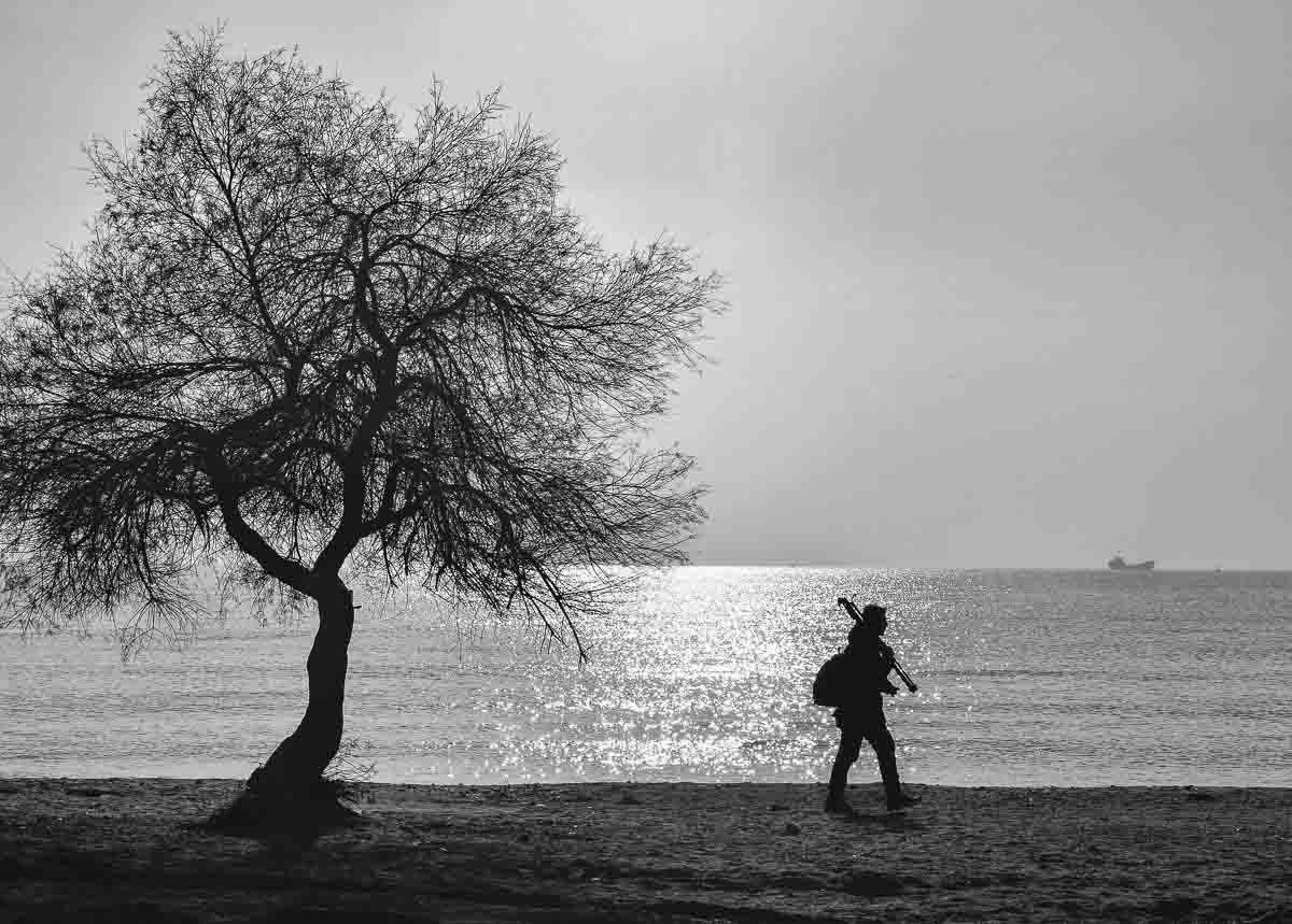 1200x859 Alone man walking on the beach. Alone man, Beach walk, Beach