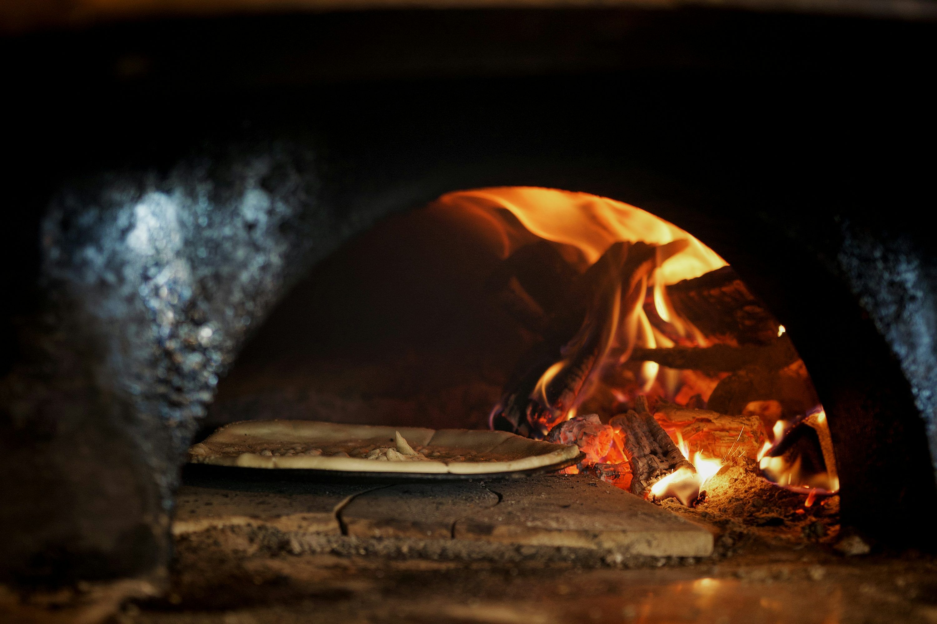 3000x2000 Pizza Baking In A Wood Fired Oven