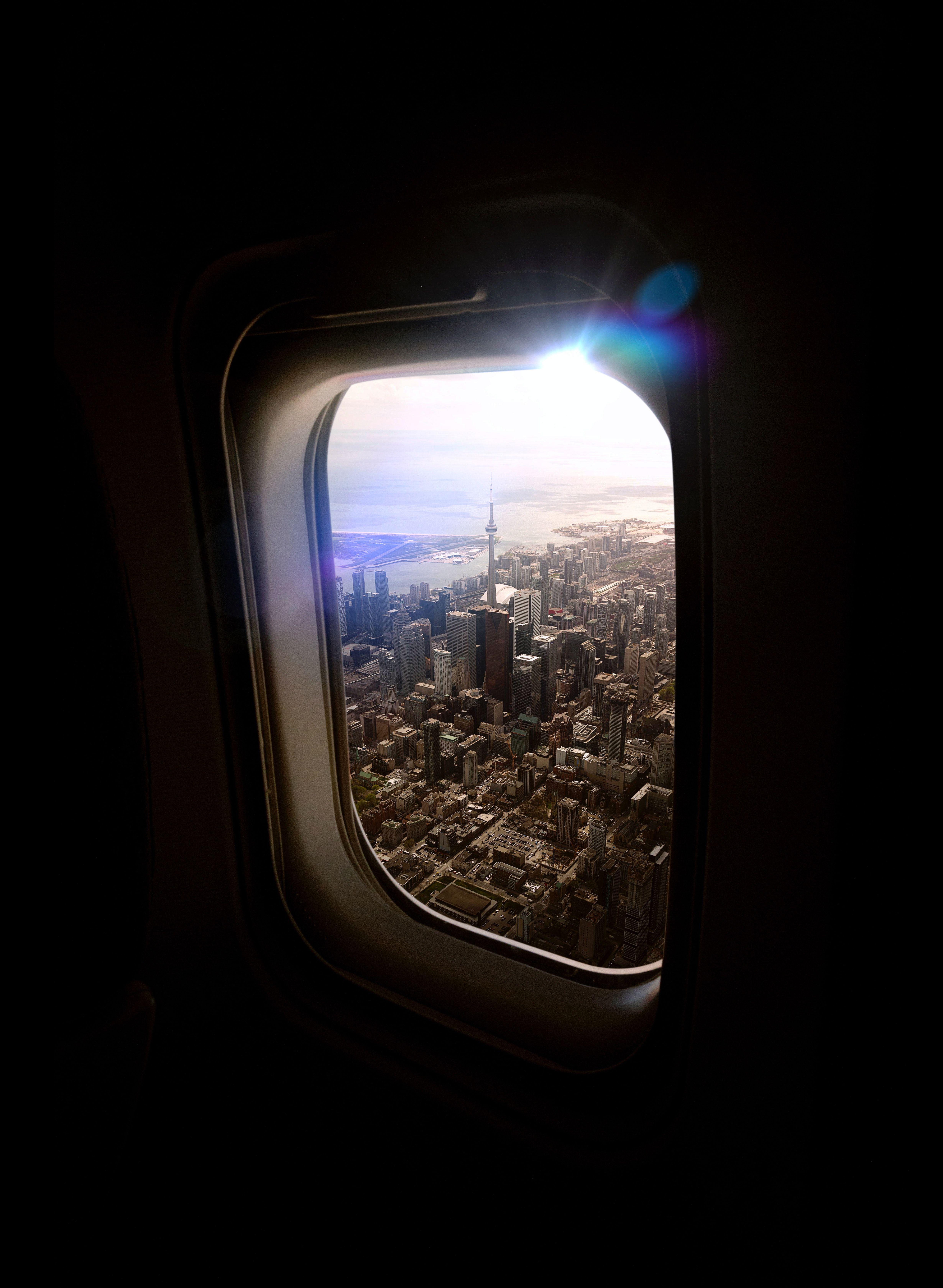 4920x6720 Aerial View Of Cityscape from An Airplane Window · Free