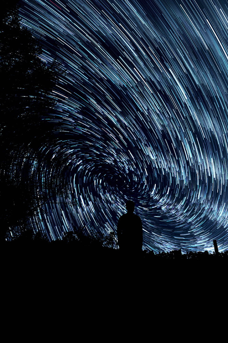 728x1092 HD wallpaper: star trail, man, silhouette, rotation, circles, radiance, night