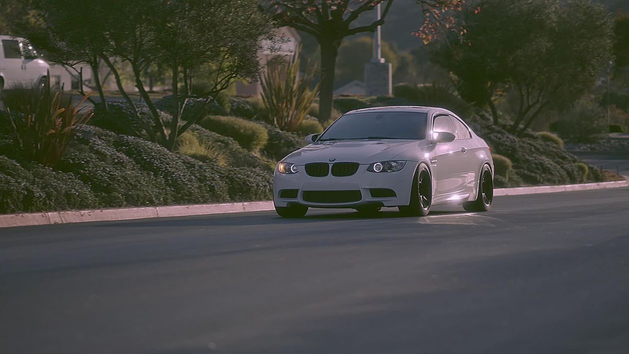 1260x709 BMW M3 Driving On Scenic Street At Dusk Free Stock Video Footage, Royalty Free 4K & HD Video Clip