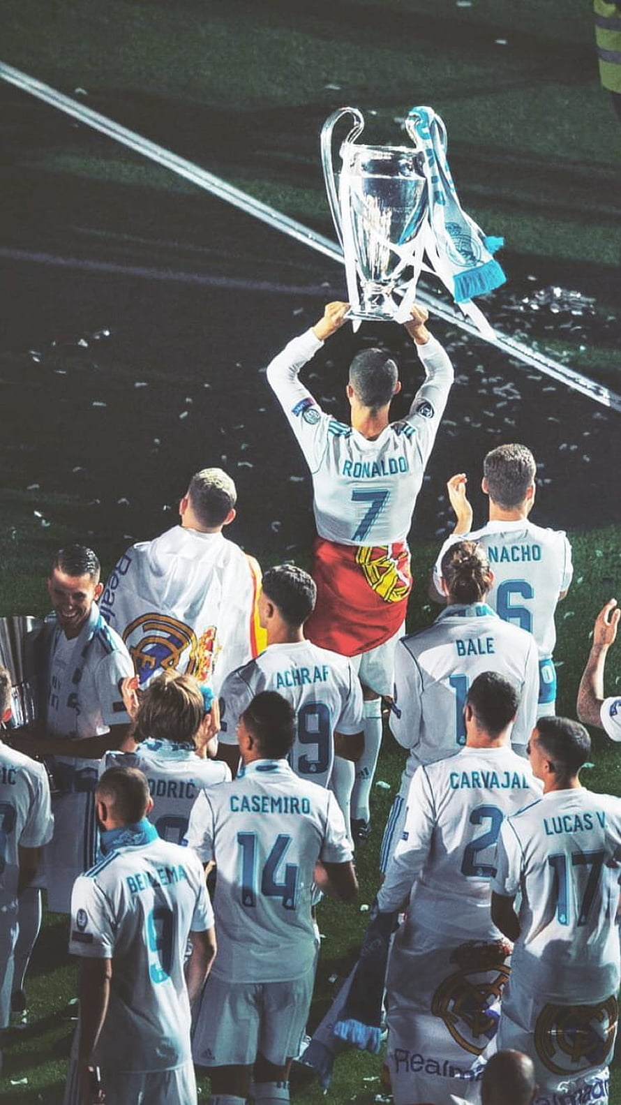 890x1583 Cristiano Ronaldo lifting the Champions League trophy with Real Madrid teammates on the pitch HD phone wallpaper