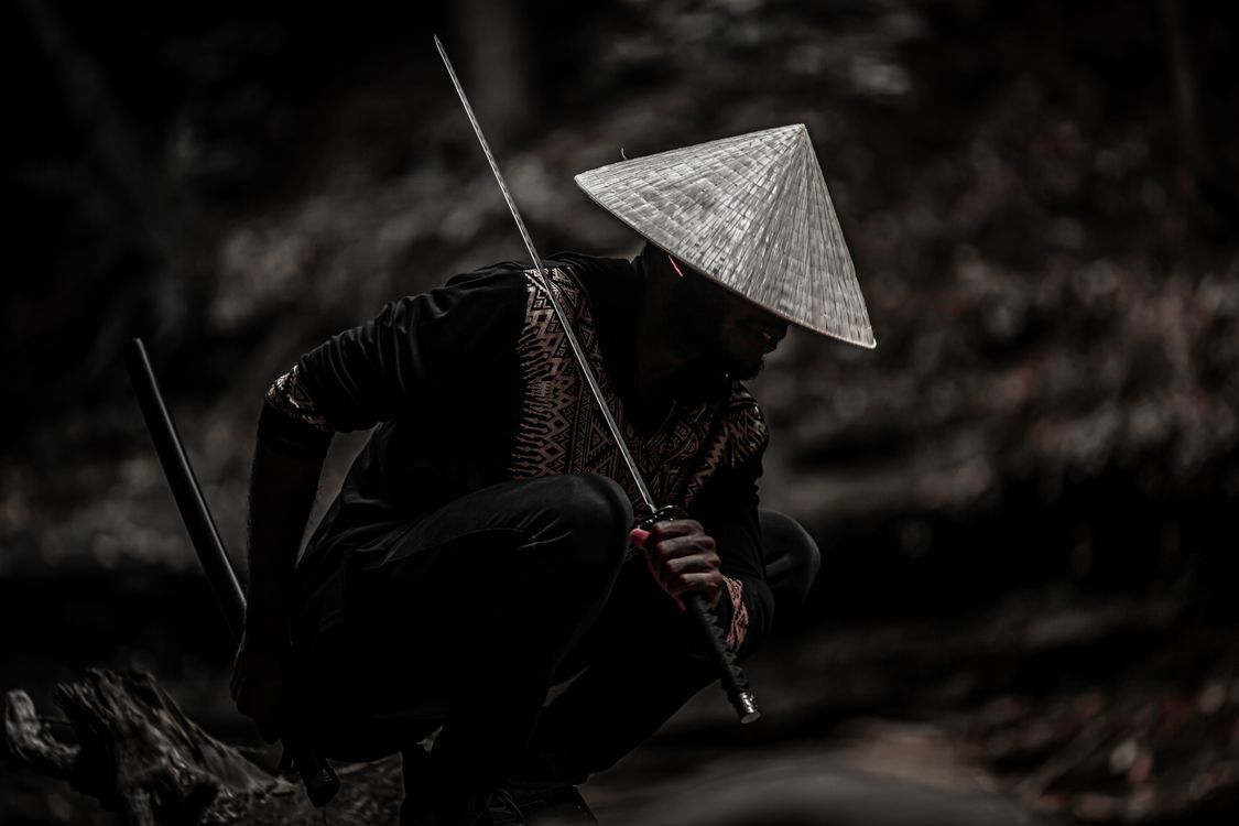 1125x750 A Man Holding a Samurai · Free