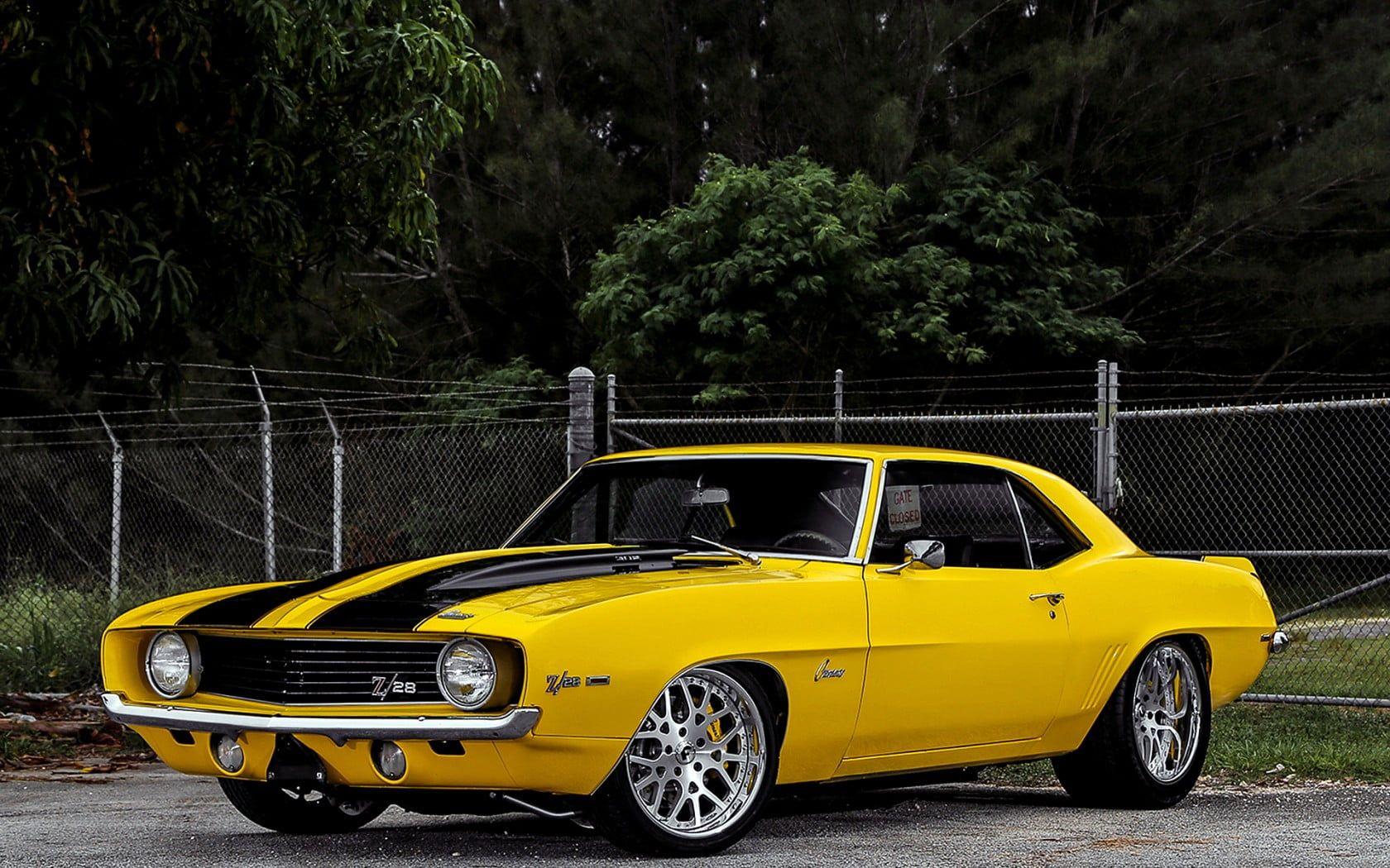 1680x1050 Yellow and black Chevy Camaro HD wallpaper