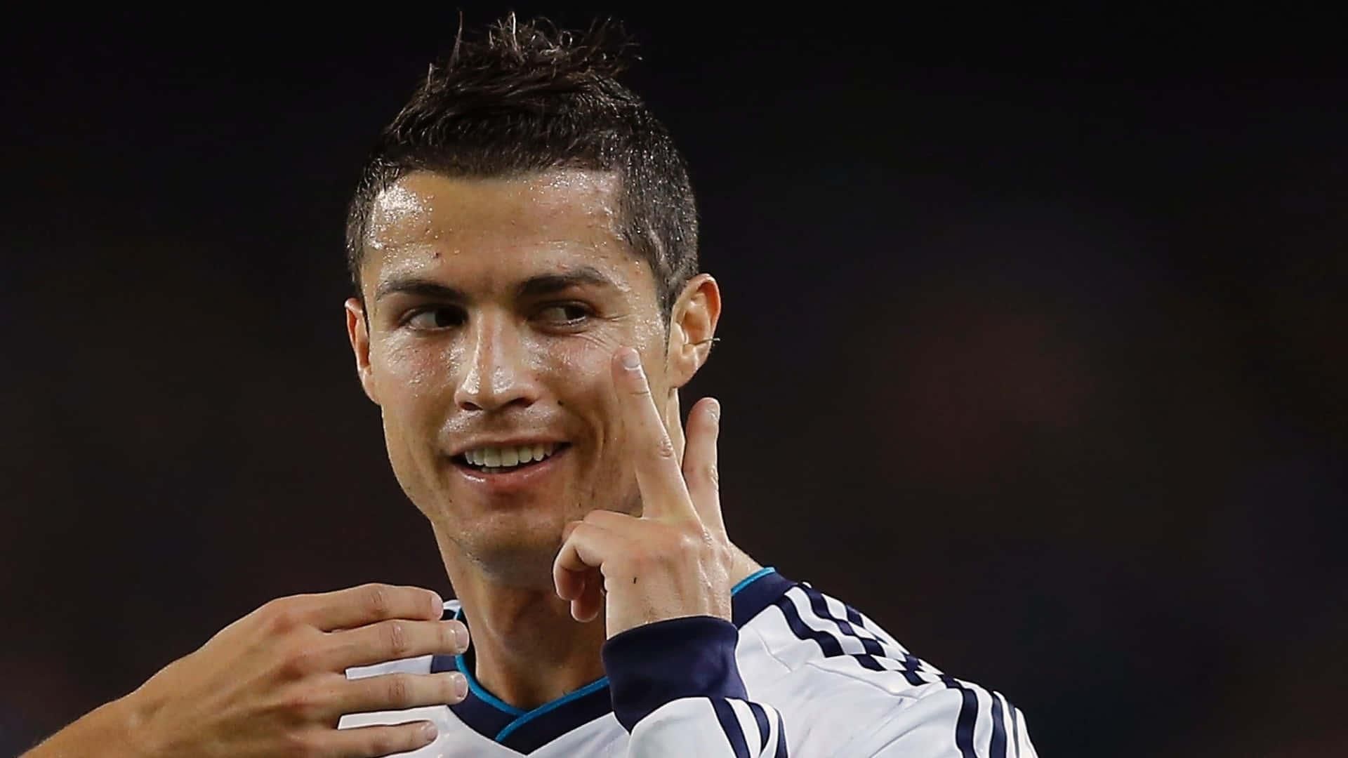 1920x1080 Cristiano Ronaldo striking an iconic pose on the football field