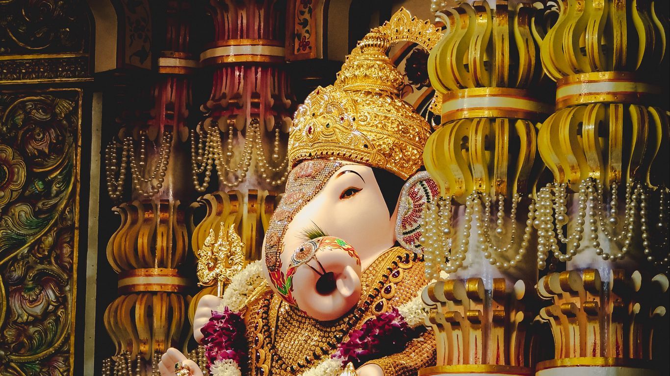 1366x768 Download wallpaper 1366x768 ganesha, deity, god, religion, statuette, columns, golden tablet, laptop HD background