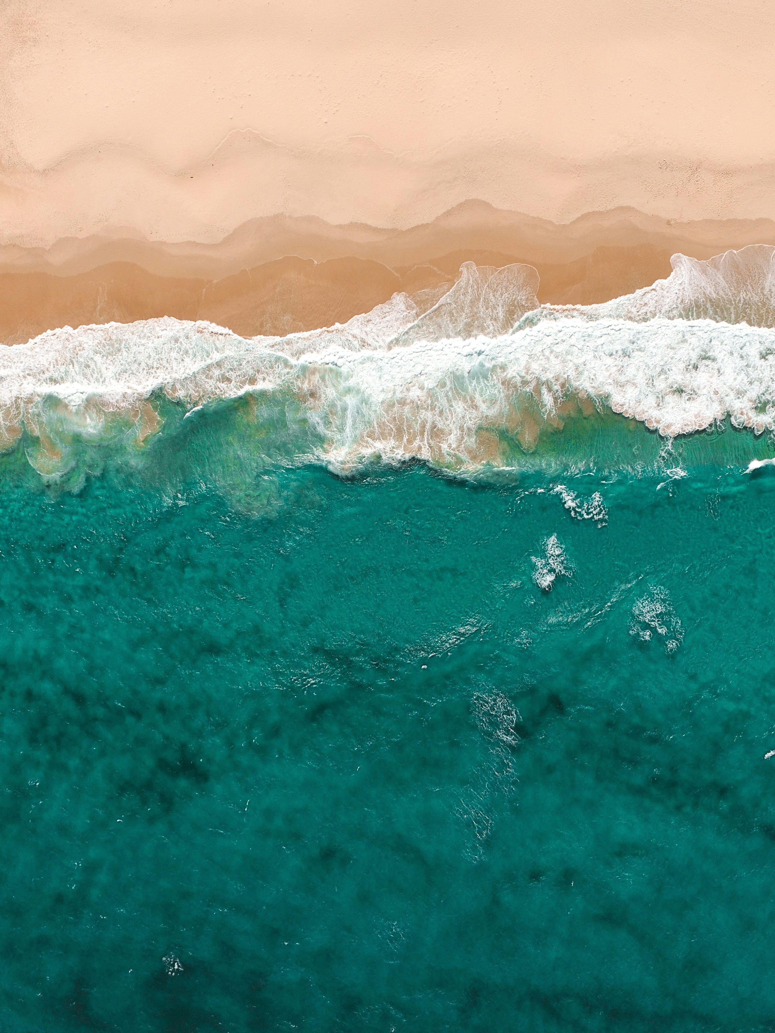 3000x4000 Aerial view of waves meeting sand