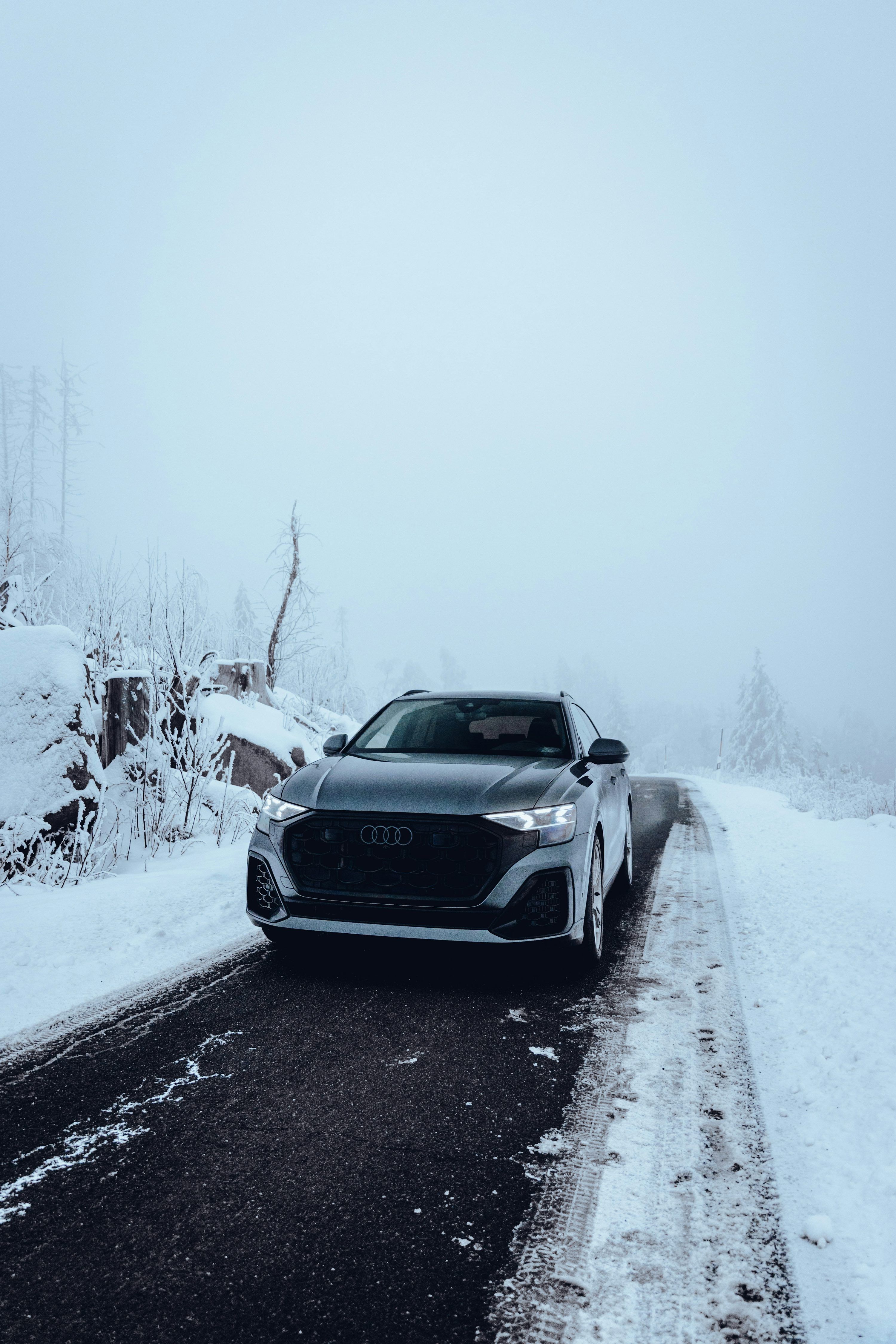 3000x4500 A grey audi drives on a snowy road photo