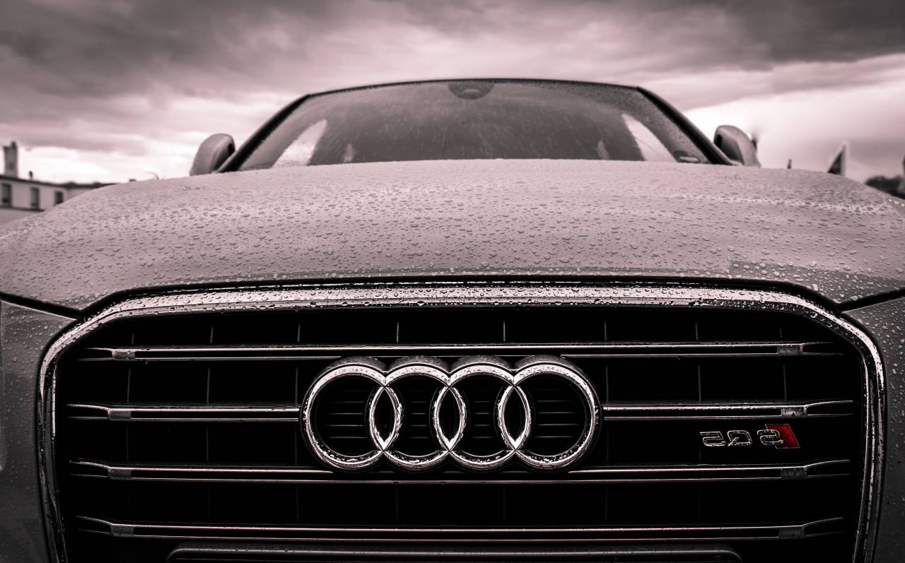 1280x797 Sleek Audi Car with Raindrops on the Hood