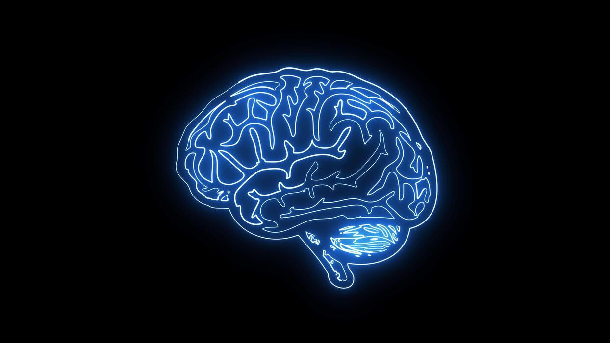 1244x700 Glowing neon outline of human brain on dark background