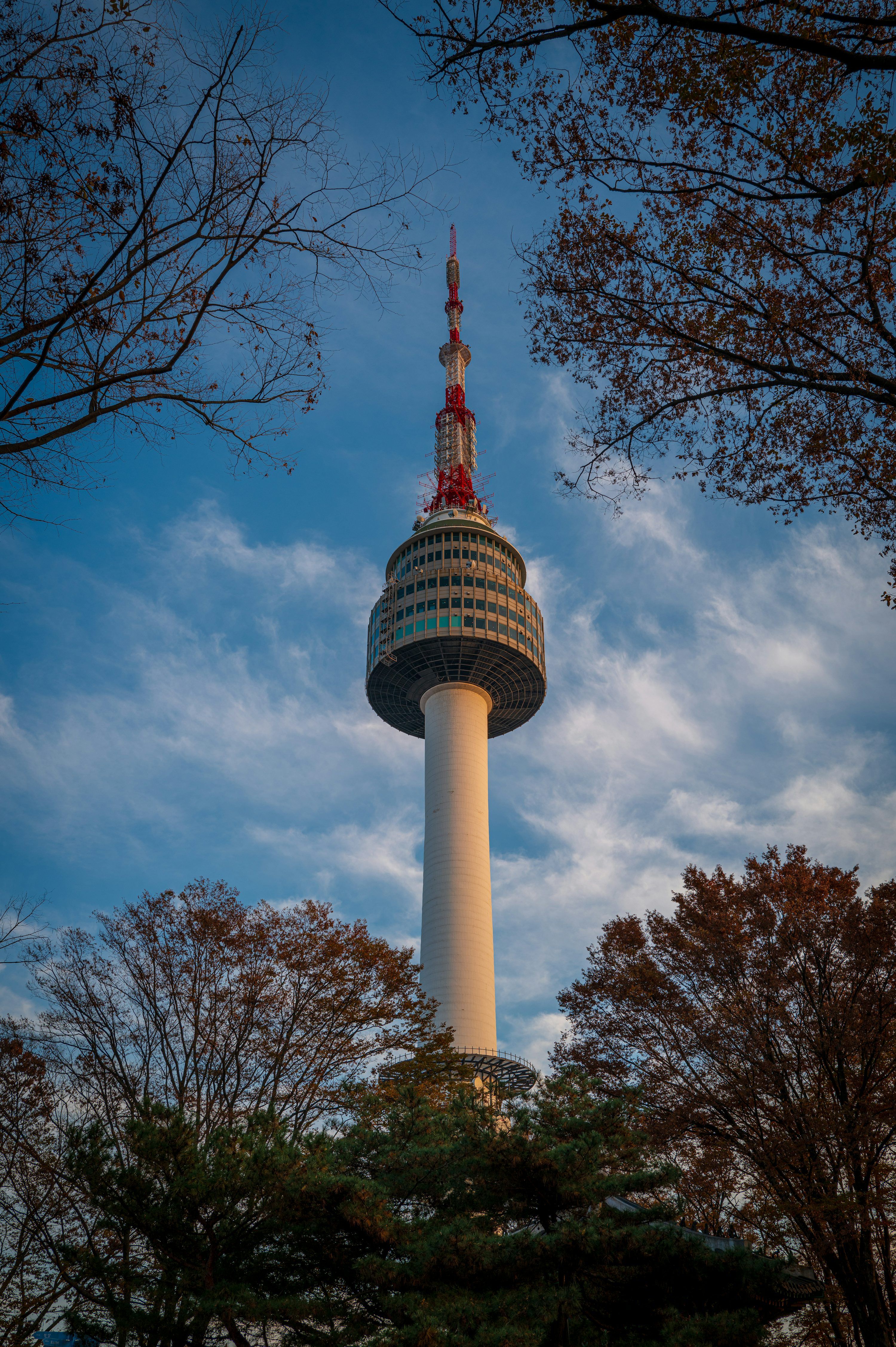 3000x4508 A tall tower with a statue on top