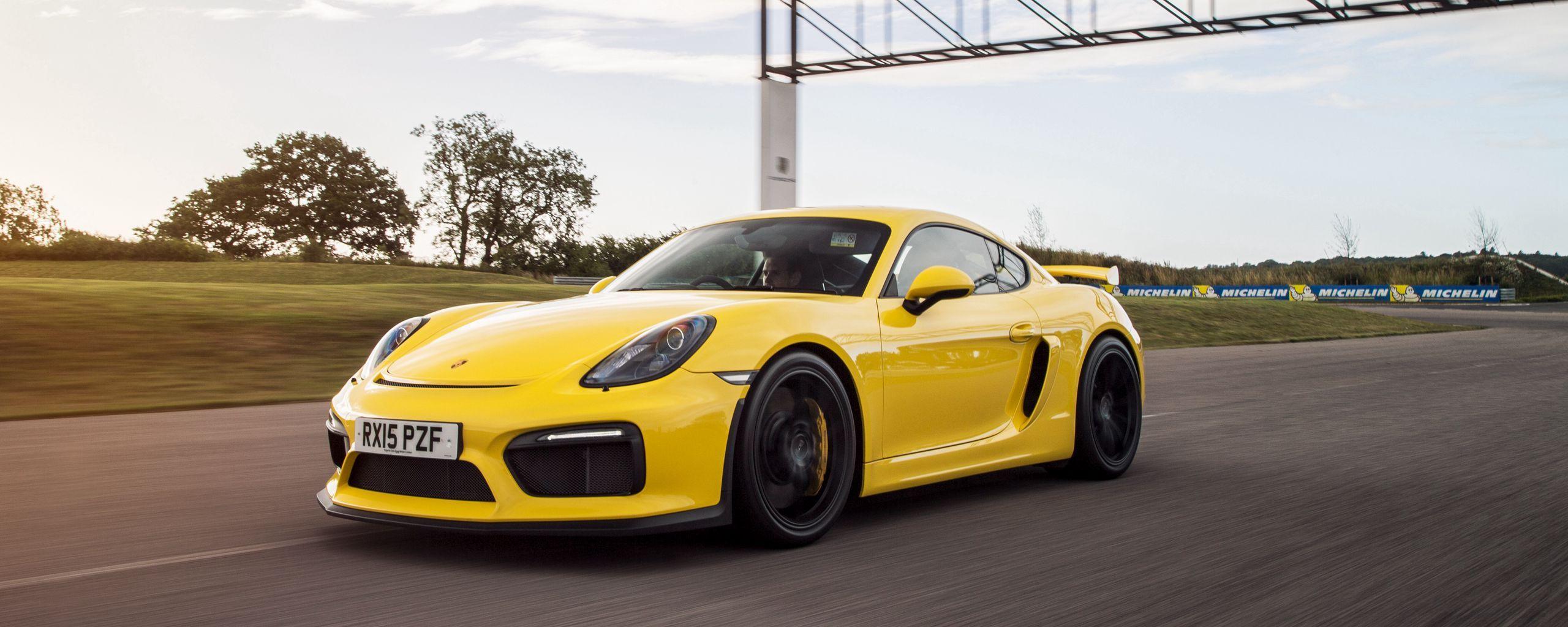 2560x1024 Download wallpaper 2560x1024 porsche, cayman, gt yellow, side view ultrawide monitor HD background