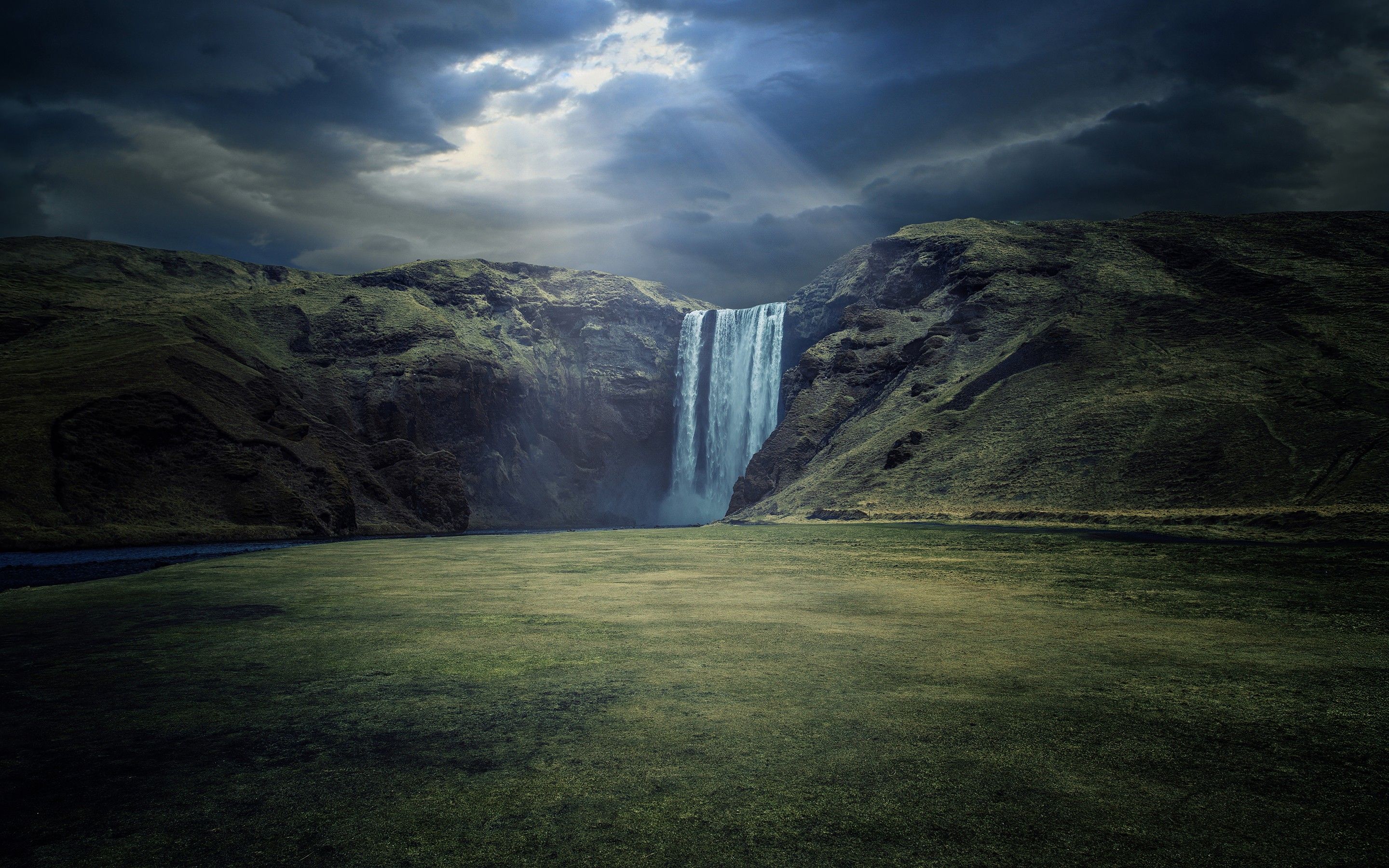 2880x1800 Wallpaper Waterfalls on Green Grass Field Under Cloudy Sky During Daytime, Background Free Image