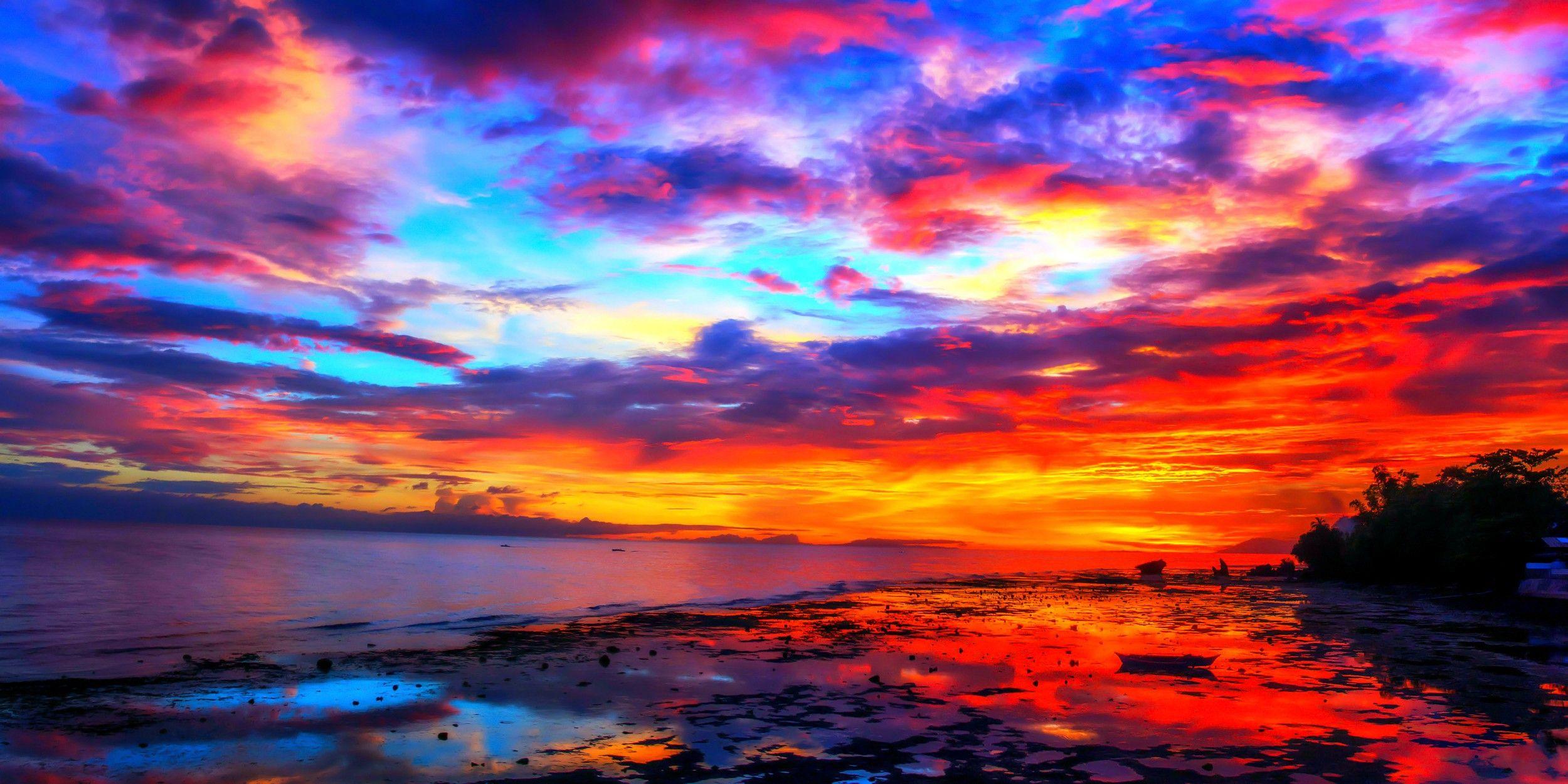 2500x1250 Sunsets Fiery Sunset Colorful Skies Ocean Sky Colors Resolution Colorful Sky HD Wallpaper