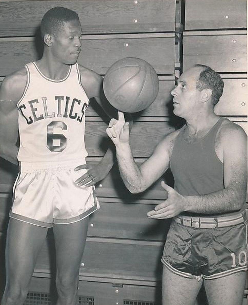 968x1192 Red Auerbach Shows Rookie Bill Russell HOw To Spin A Ball
