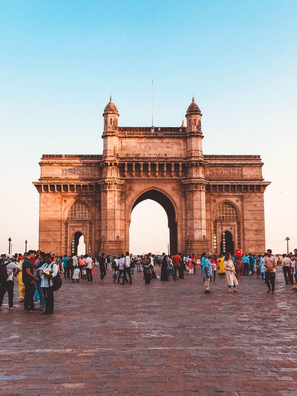1000x1333 people walking on arch gate during daytime photo