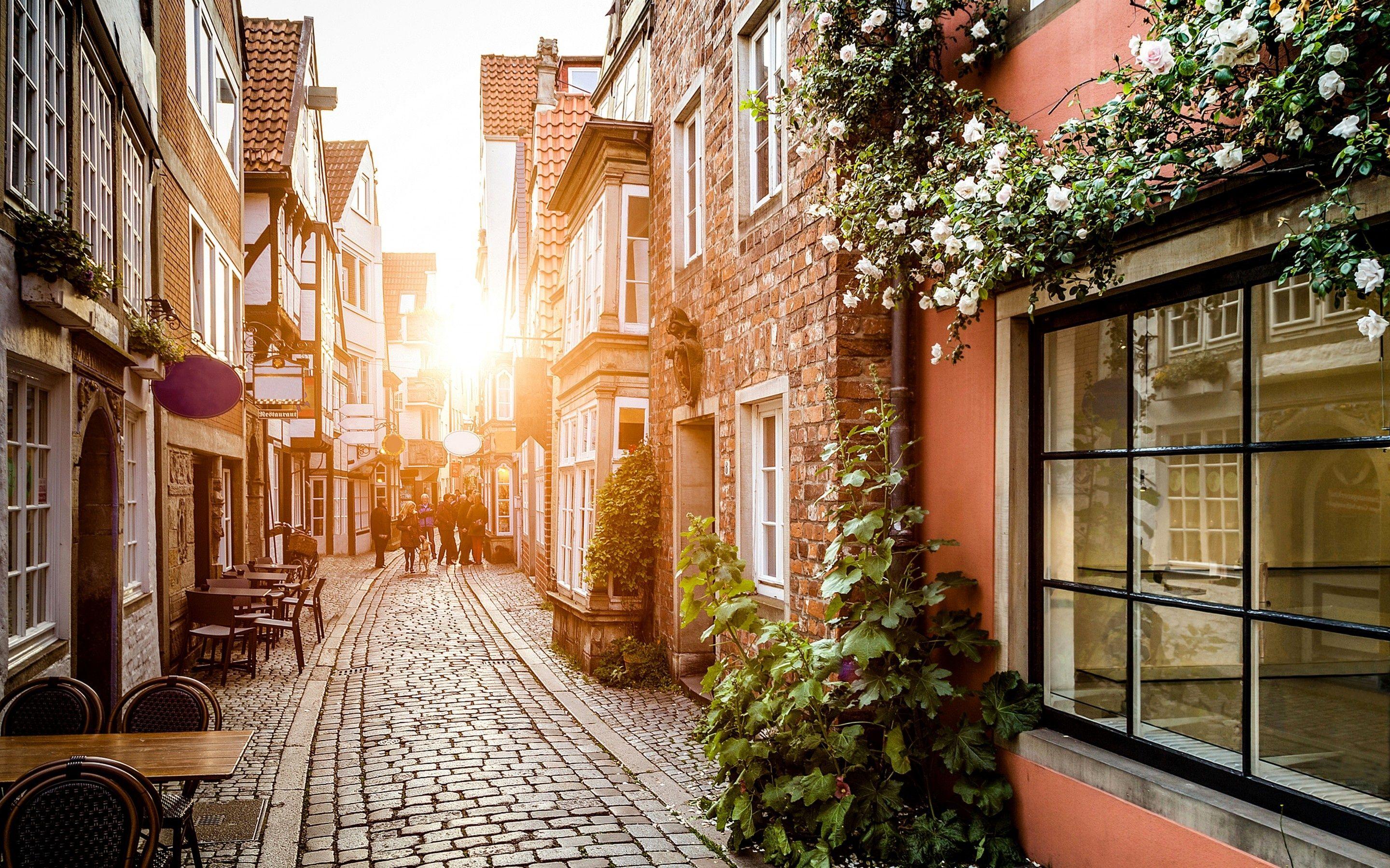2880x1800 Wallpaper germany, city, house, flowers, road, pavement, cafe desktop wallpaper World