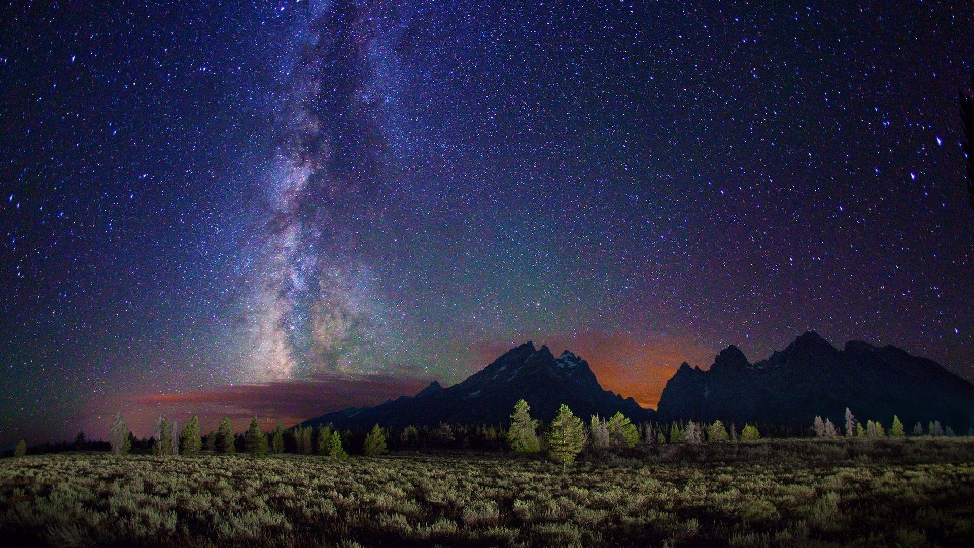 1920x1080 Download wallpaper 1920x1080 milky way, stars, mountains, field