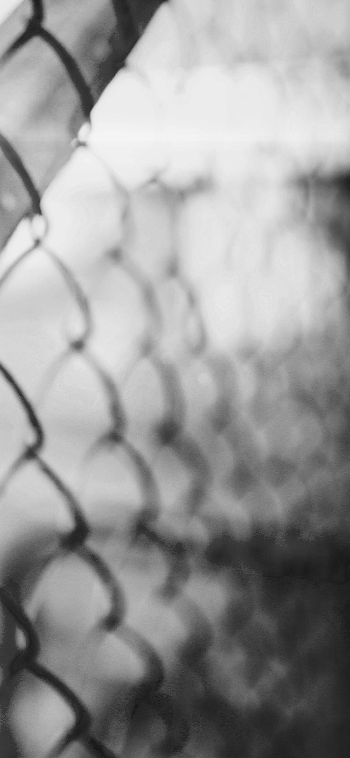 1125x2436 Vintage Wall Metal City Bokeh Flare Bw Dark Wallpaper
