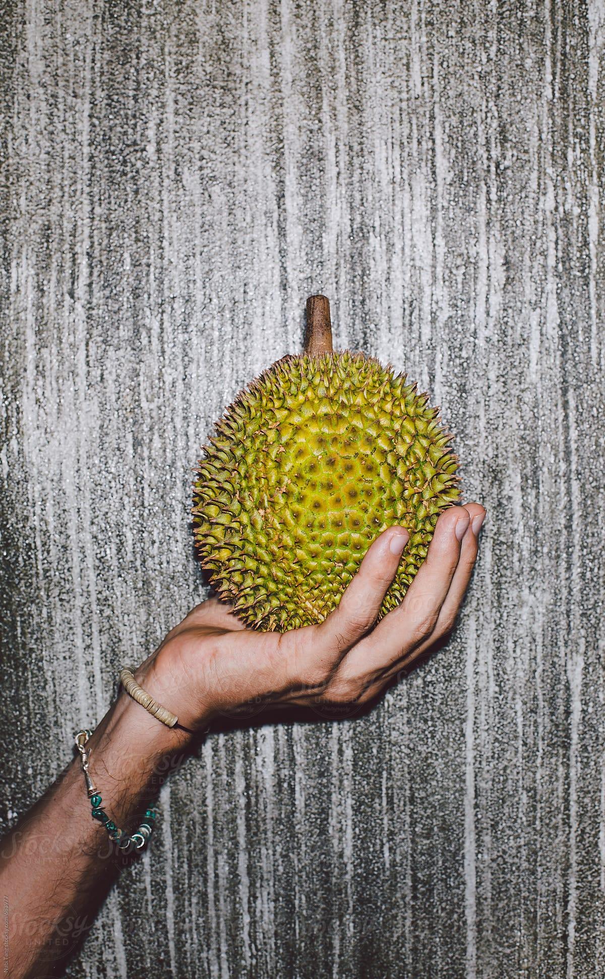 1200x1941 Man holding durian