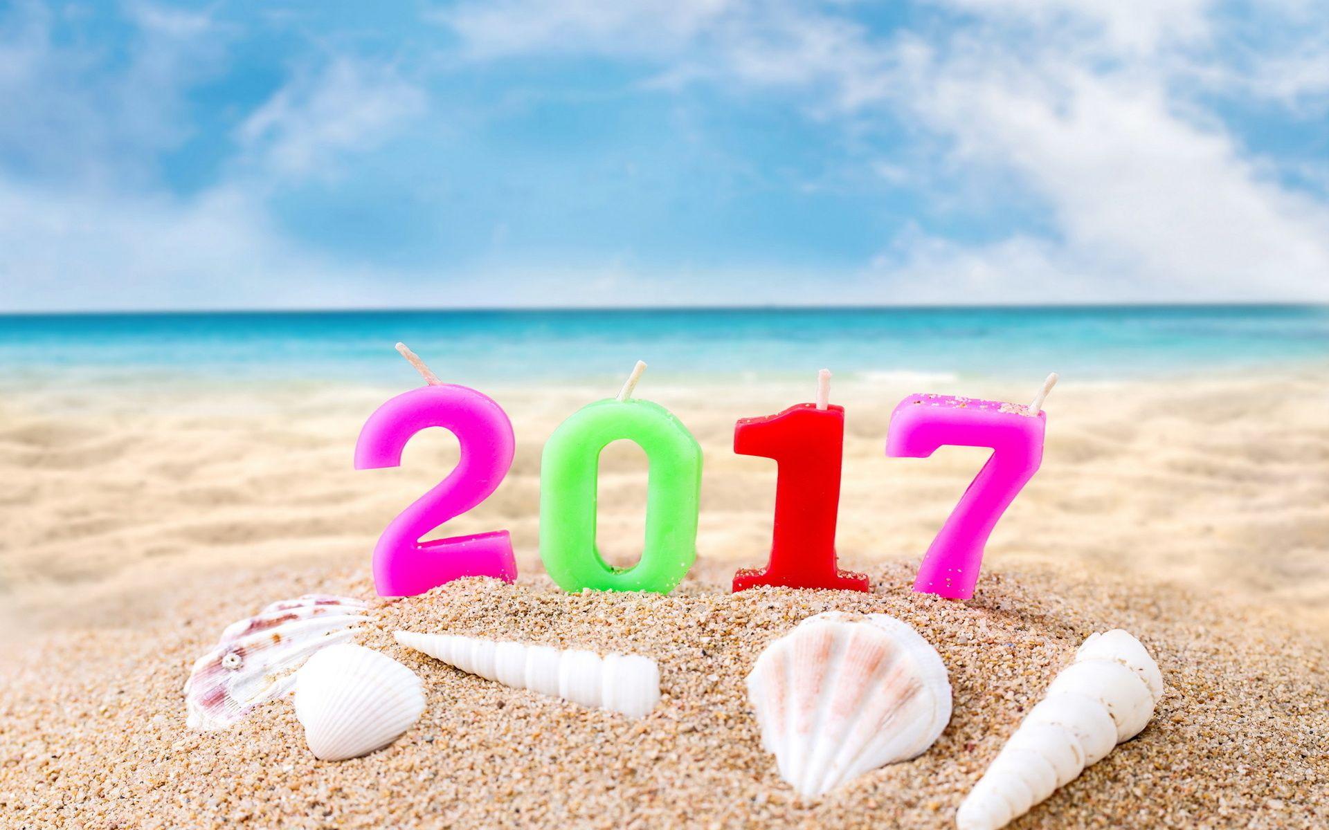 1920x1200 Happy New Year 2017 Candle In Beach Sand Wallpaper 11969