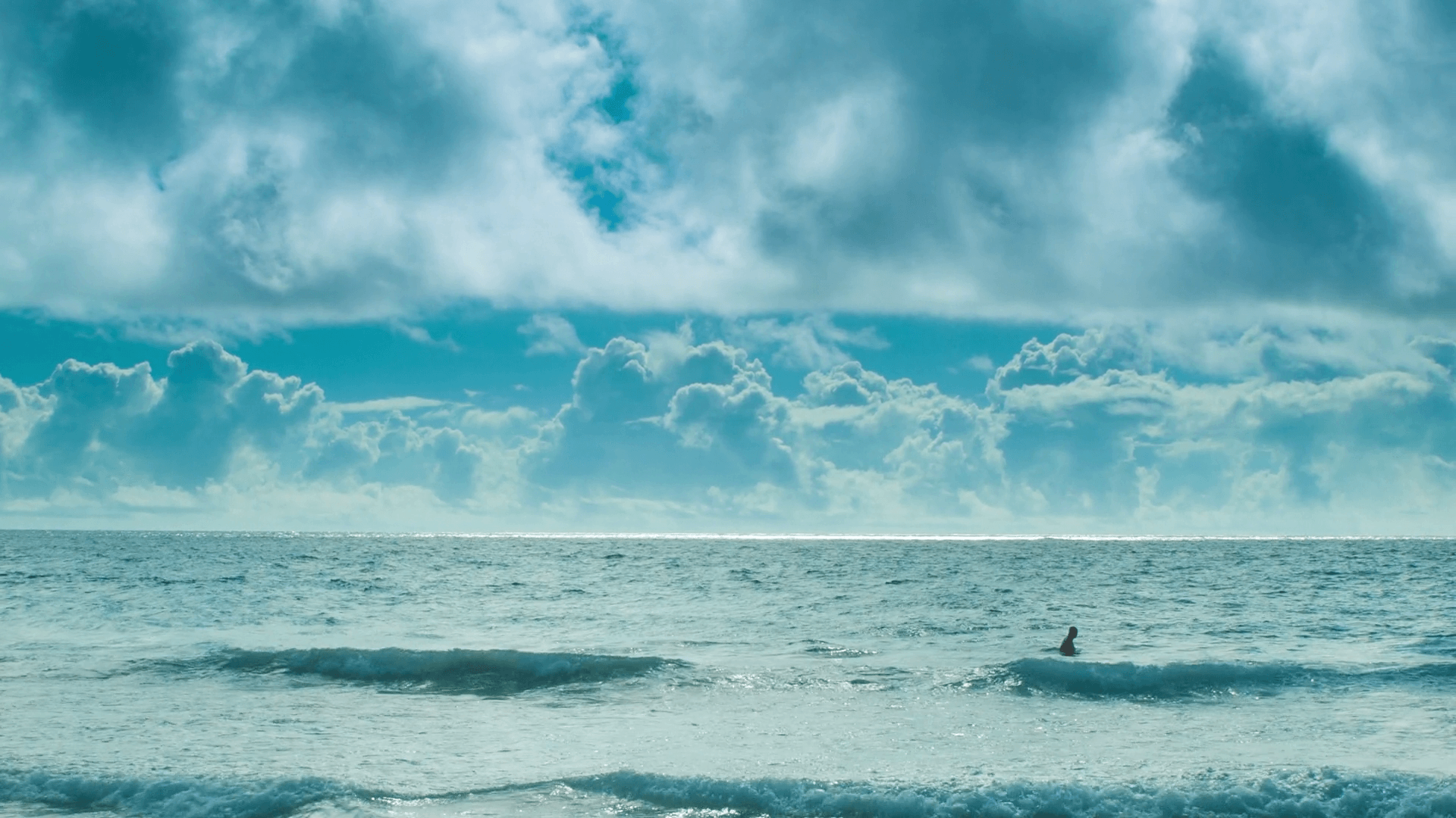1920x1080 Man Swimming Alone in a Vast Ocean in the Bermuda Triangle in Front