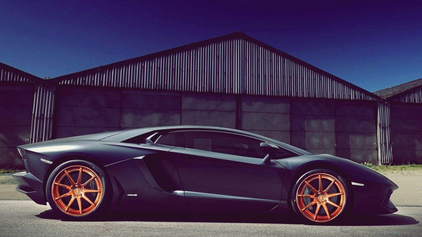 1366x768 Black Lamborghini Aventador With Orange Rims desktop PC and Mac wallpaper