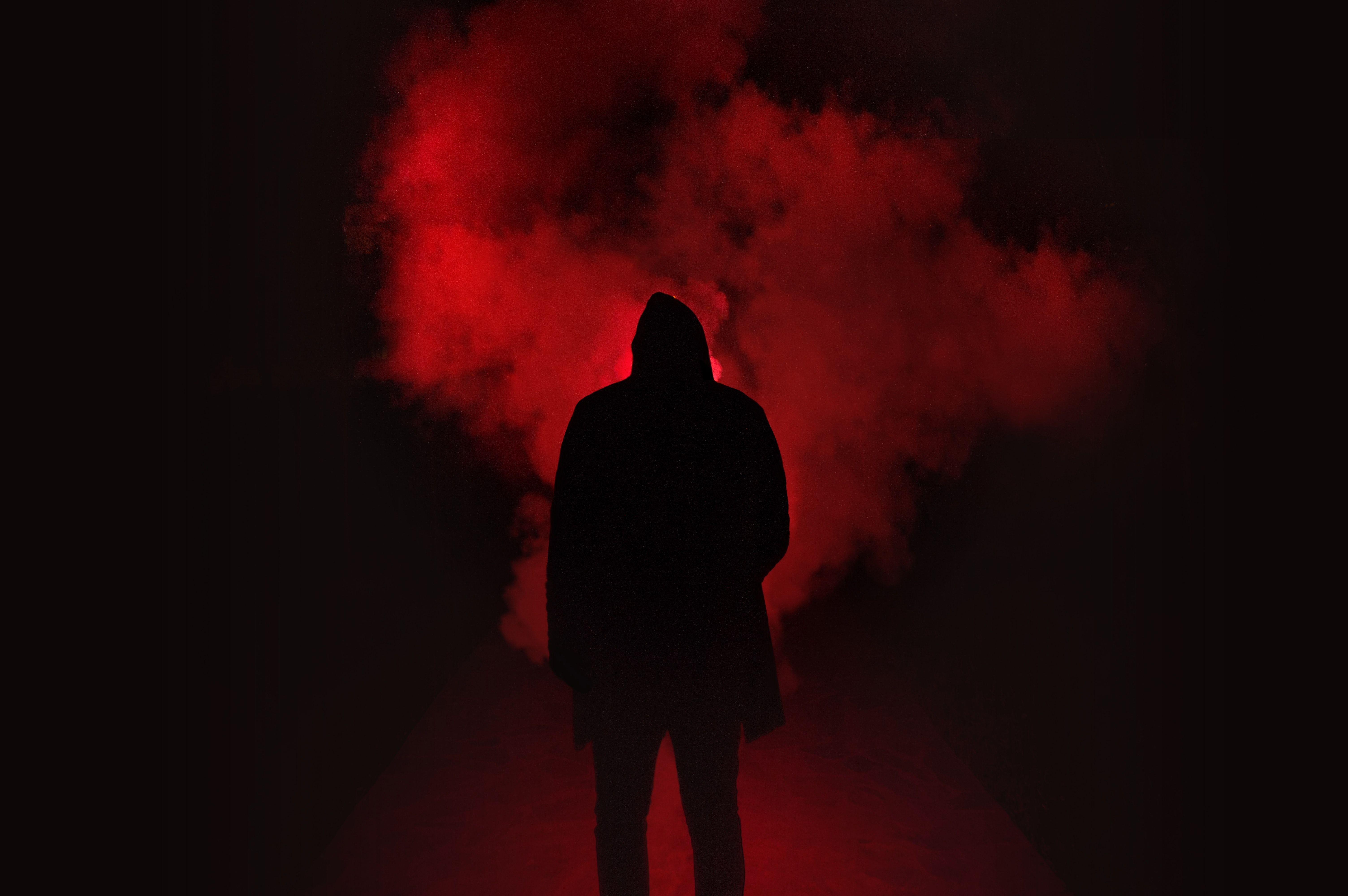 6016x4000 Silhouette of Man Standing Against Black And Red Background · Free
