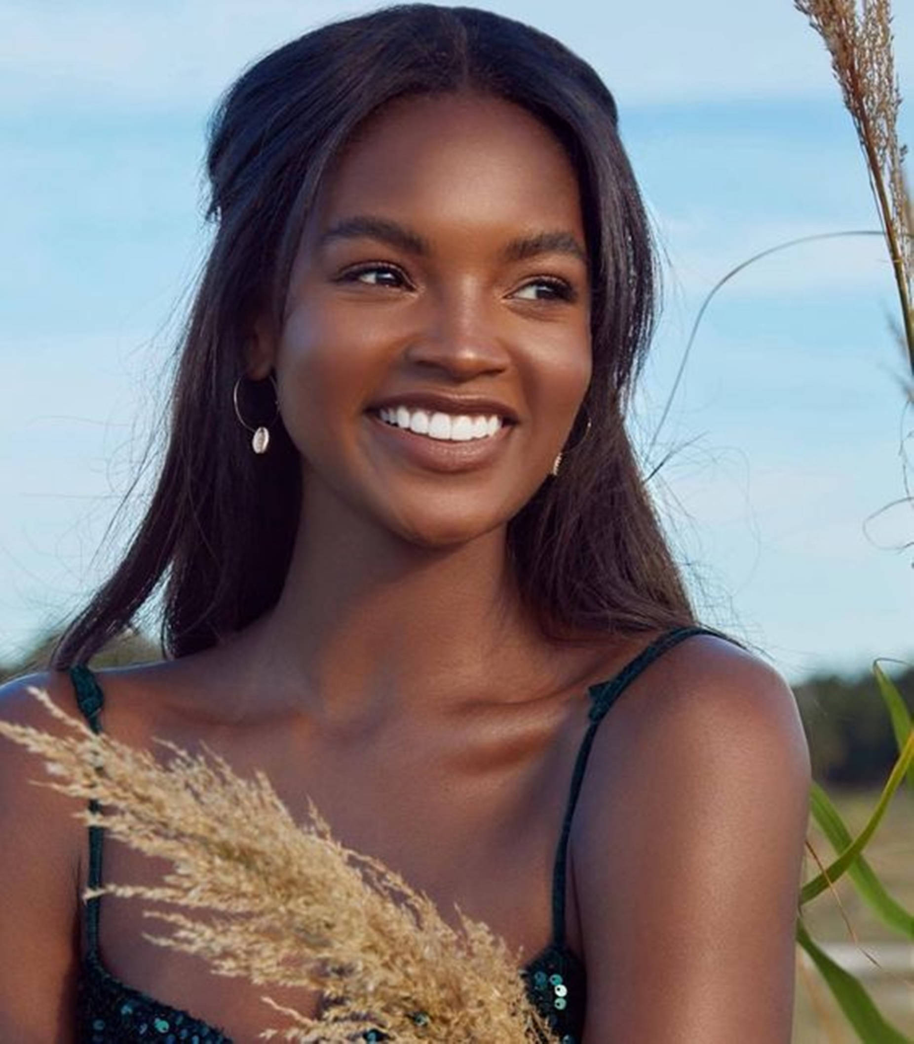 1852x2115 Download Beautiful Black Woman Posing With A Sprig Of Wheat Wallpaper