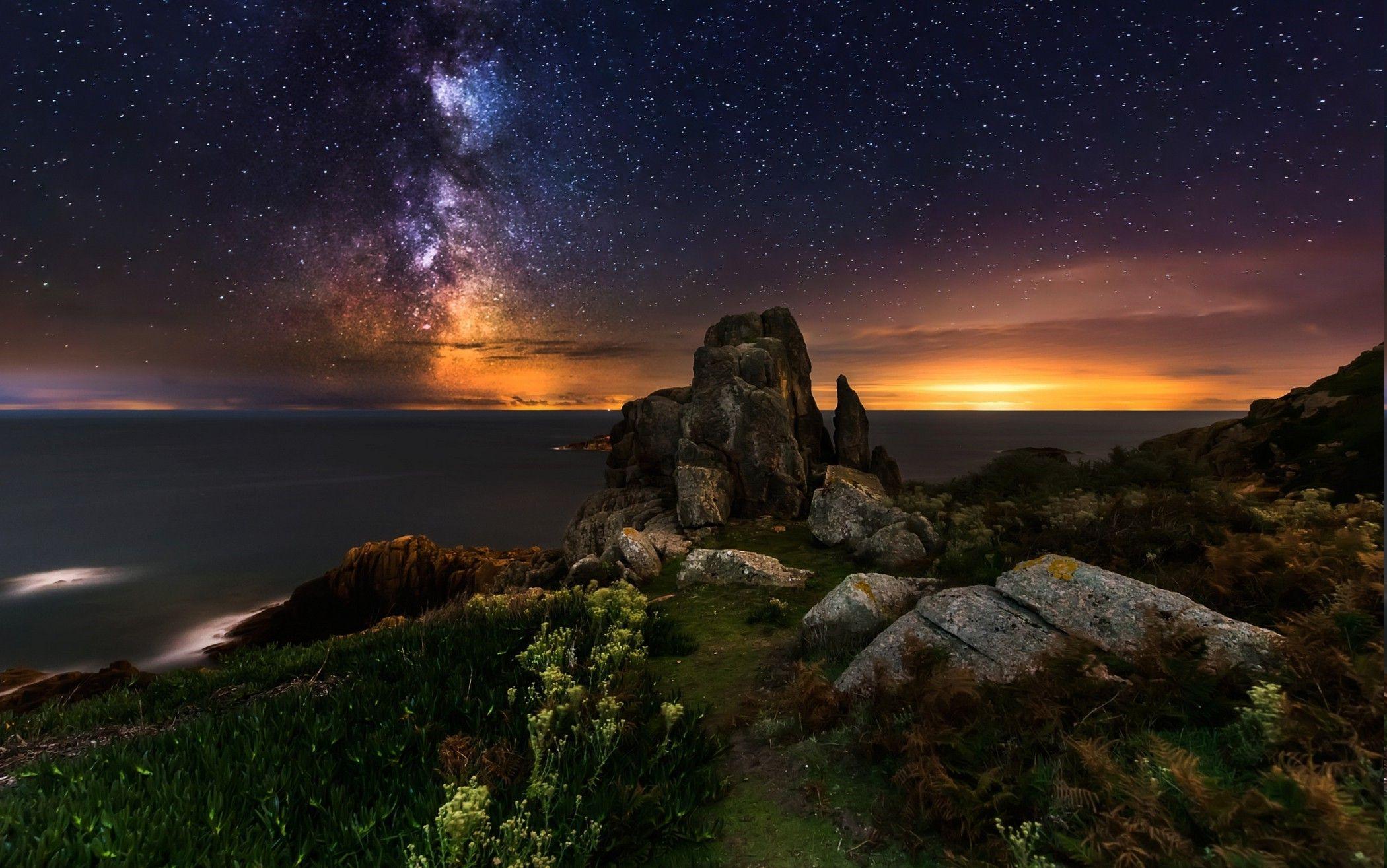 2100x1315 nature landscape wildflowers rock sea coast france milky way galaxy stars sunrise long exposure wallpaper