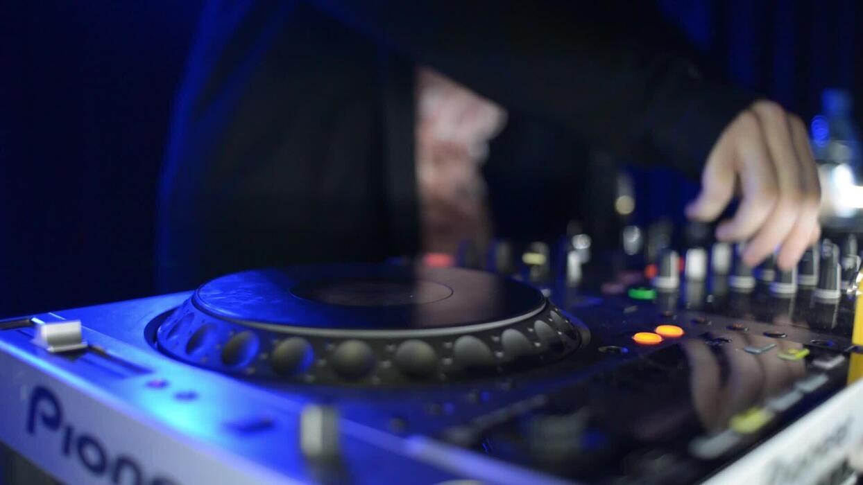 1244x700 Hands Of Dj Tweak Controls On Record Deck In Night Club. Turntable, Mixer, Plate
