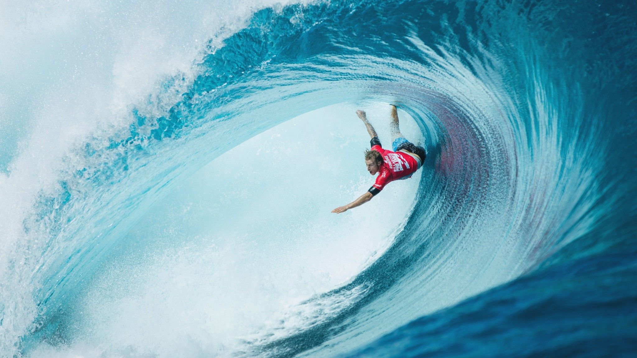 2048x1152 Wallpaper Man in Red Wetsuit Surfing on Blue Ocean Water During Daytime, Background Free Image