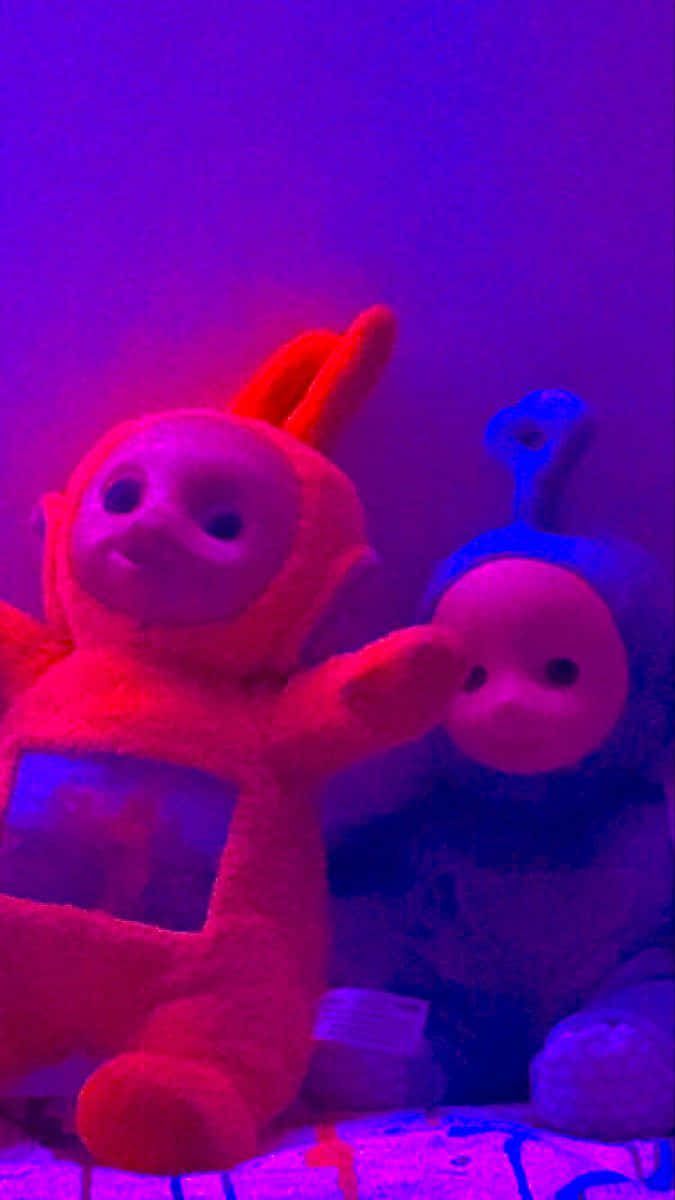 675x1200 Download a stuffed animal is sitting on a bed Background