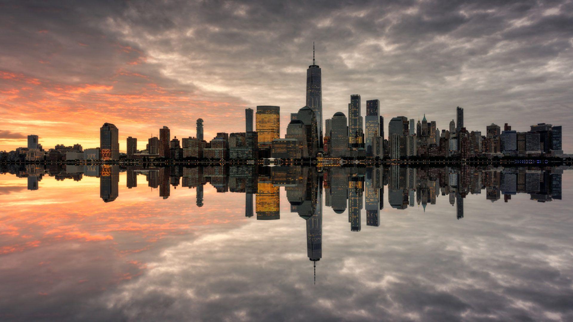 1920x1080 Manhattan Skyline The Most Populated New York City Sunnset Reflection In The Water Miror Ultra HD Wallpaper For Desktop Mobile Phones And Laptops 3840x2160 :