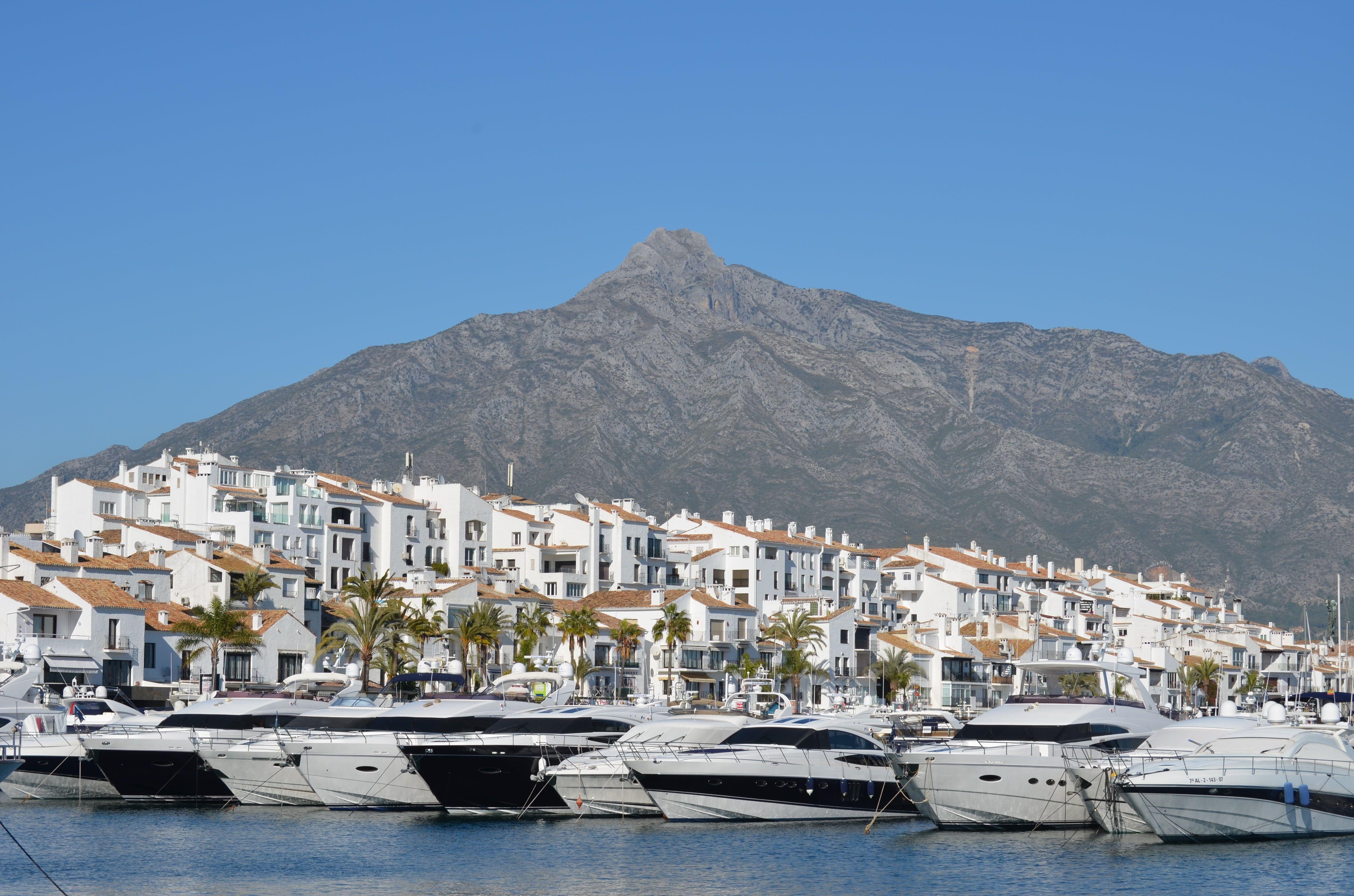 4928x3264 white speedboats floating on water puerto banus #marbella #port #boats #mountain #sierra #marina #yachts #royalty #docking. Marbella spain, Marbella, Puerto banus