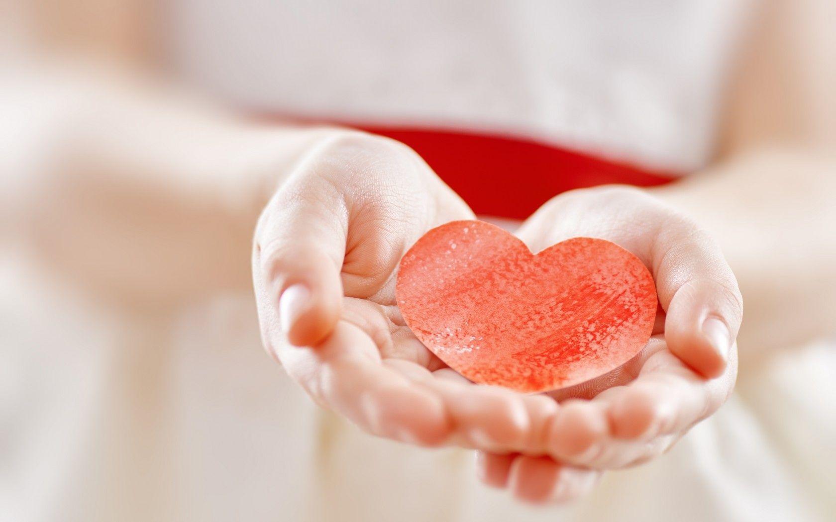 1680x1050 Cute Hand Hold Orange Heart Wallpaper
