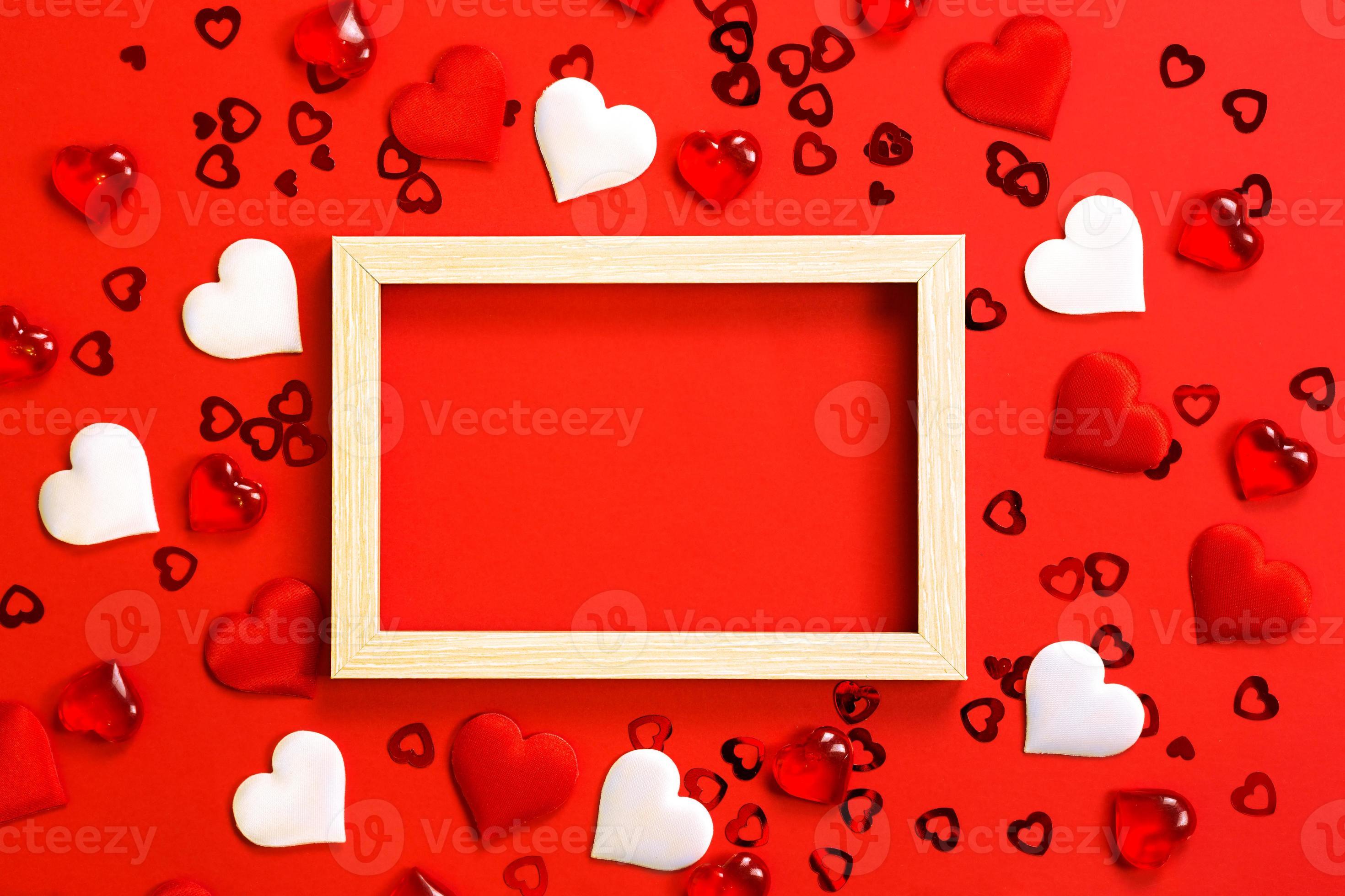 2940x1960 Text or photo frame in the center, surrounded by hearts. Decor of couples in love with hearts on a red background. Valentine's Day, message, greeting, declaration of love. Copy space 7193357 Stock