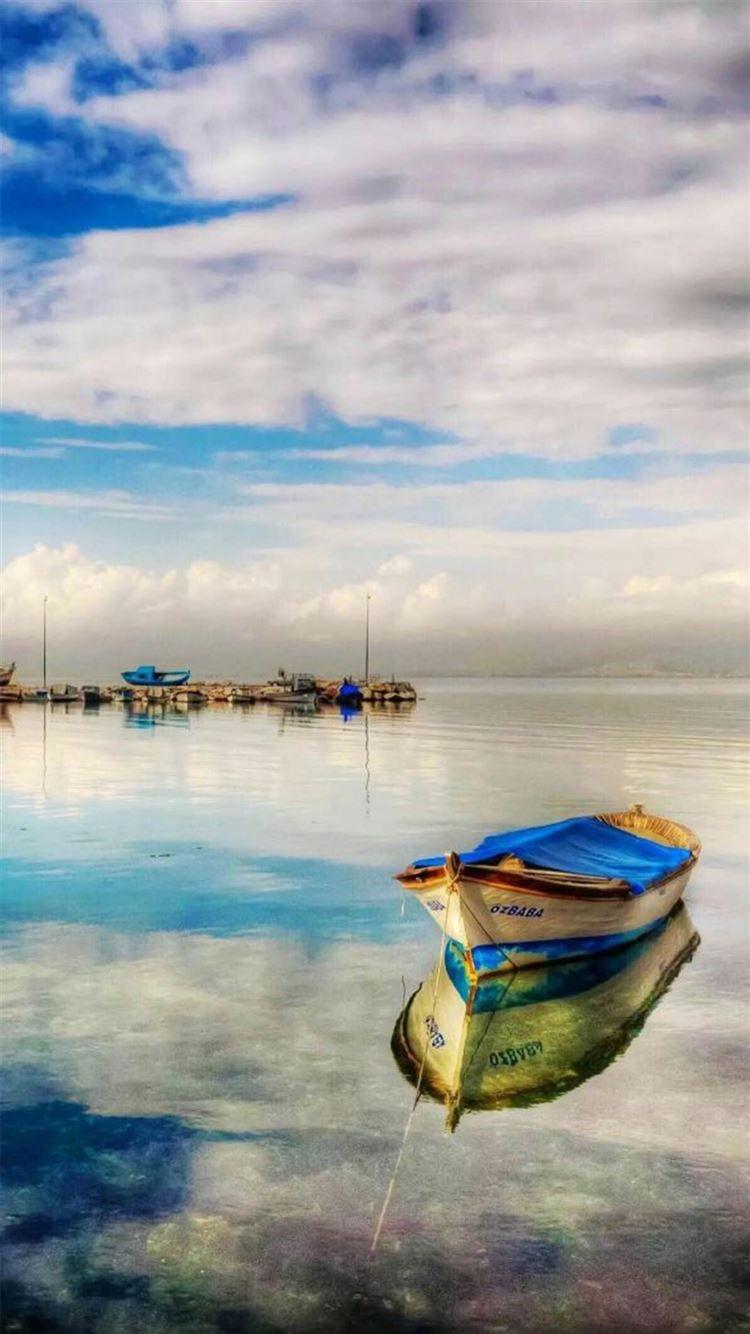 750x1334 Fairy Peaceful Clear Lake Reflection Boat Parking iPhone 8 Wallpaper Free Download