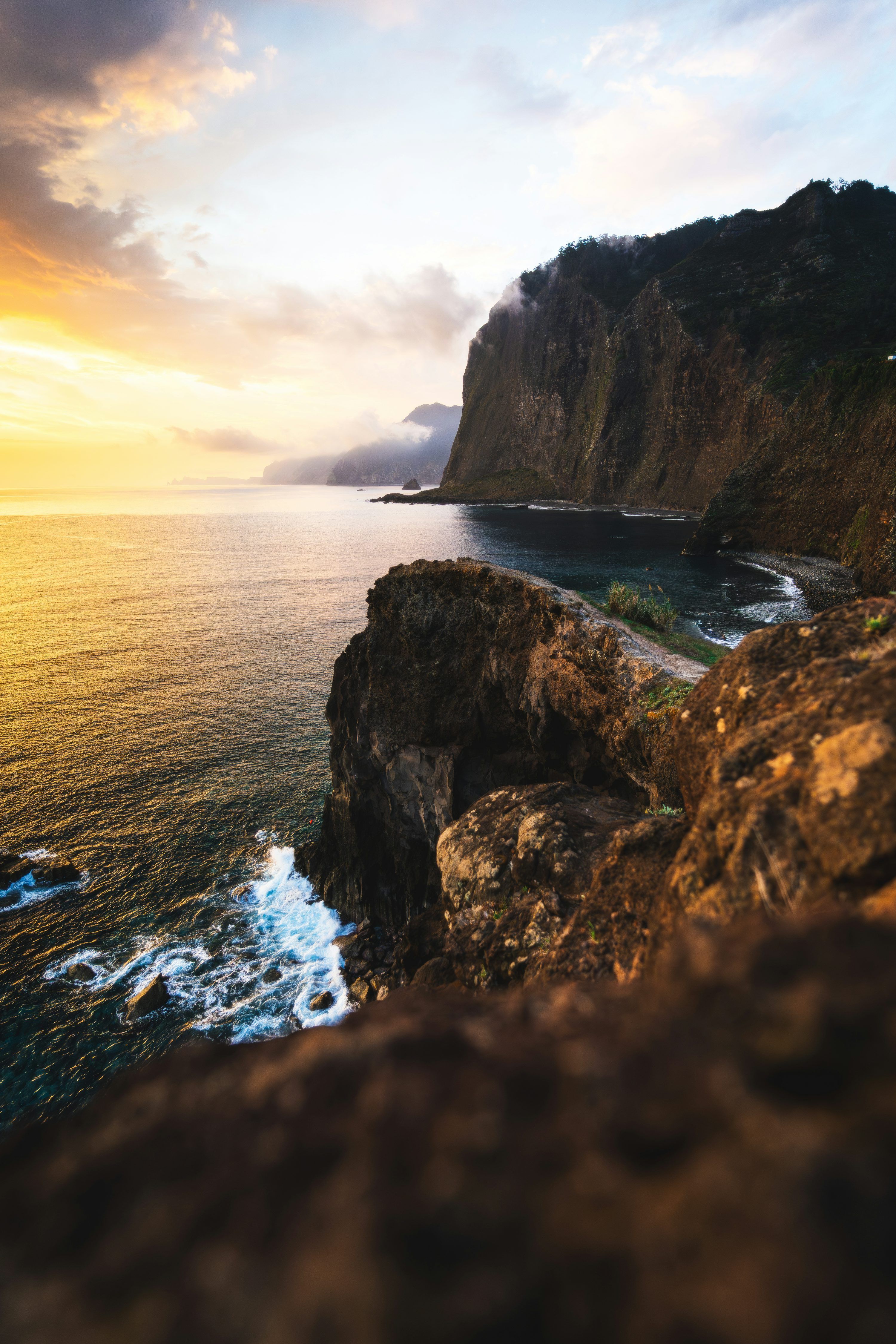 3000x4500 Dramatic cliffside overlooking the ocean at sunset