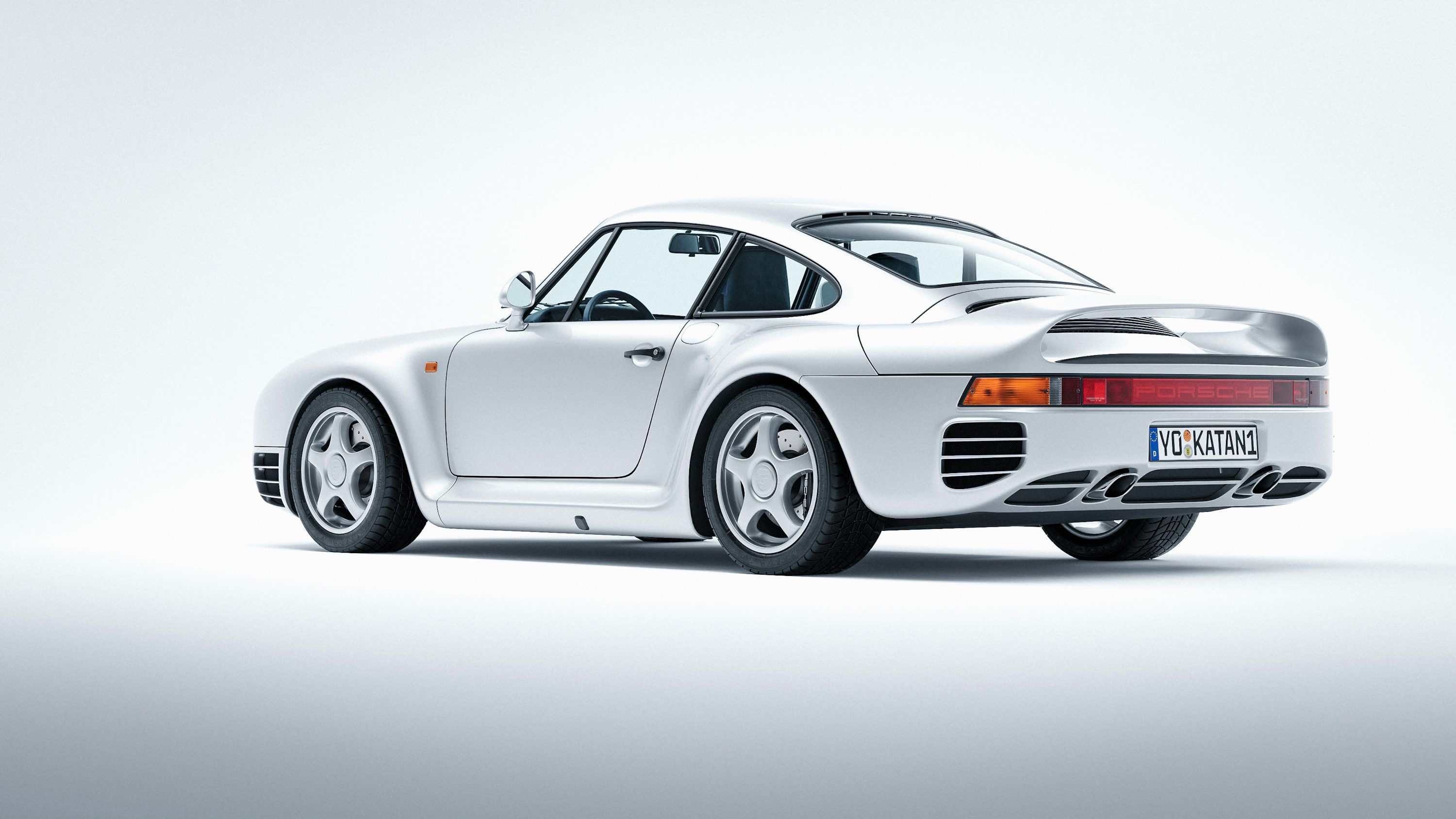3000x1688 A white porsche sports car on a white background
